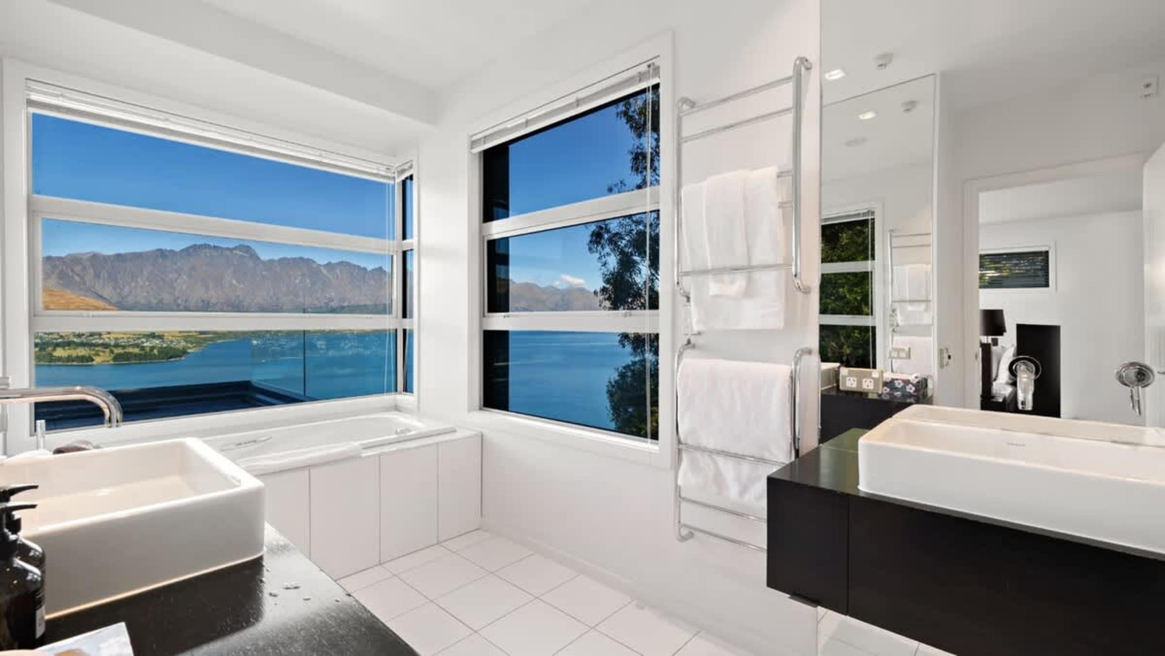 Master Bathroom with Walk-In and Bath
Indulge in the luxurious master bathroom, featuring a walk-in shower, freestanding bath, heated floors, and stunning views of Lake Wakatipu and The Remarkables for the ultimate relaxation experience.