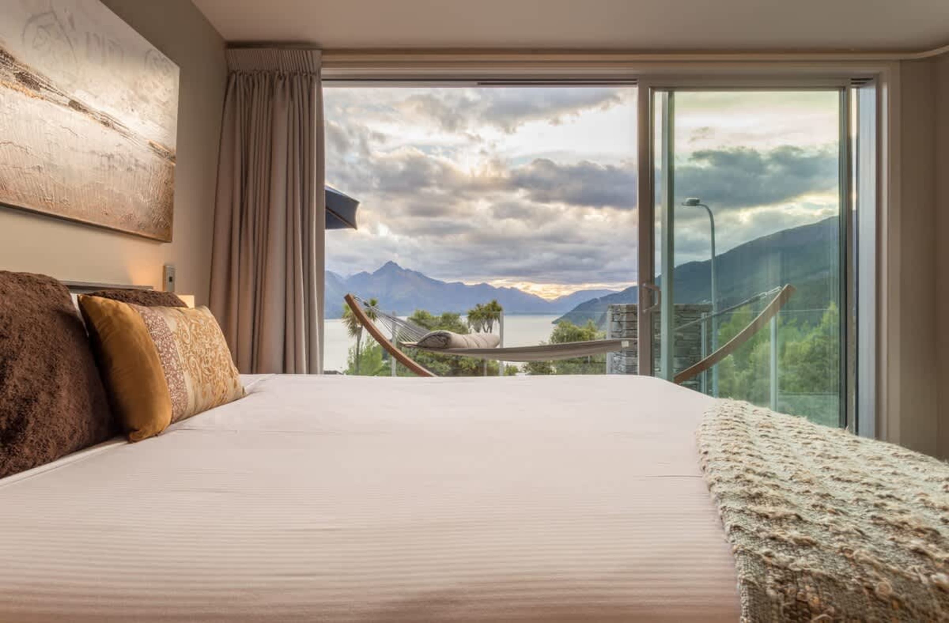 Wake up to this sunrise vista at 5 star accommodation in Queenstown