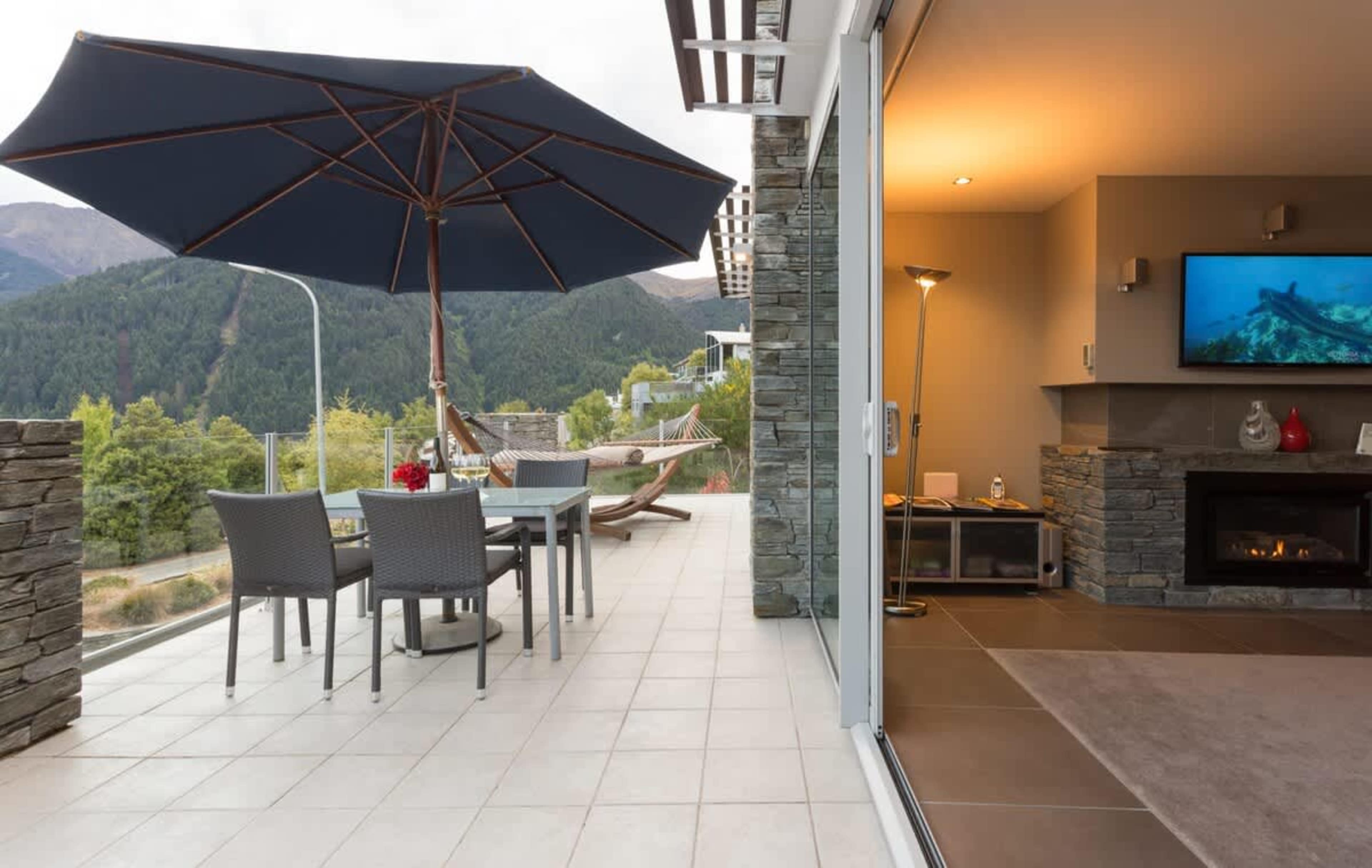 Stunning outdoor patio with mountain views, your luxury escape in New Zealand
