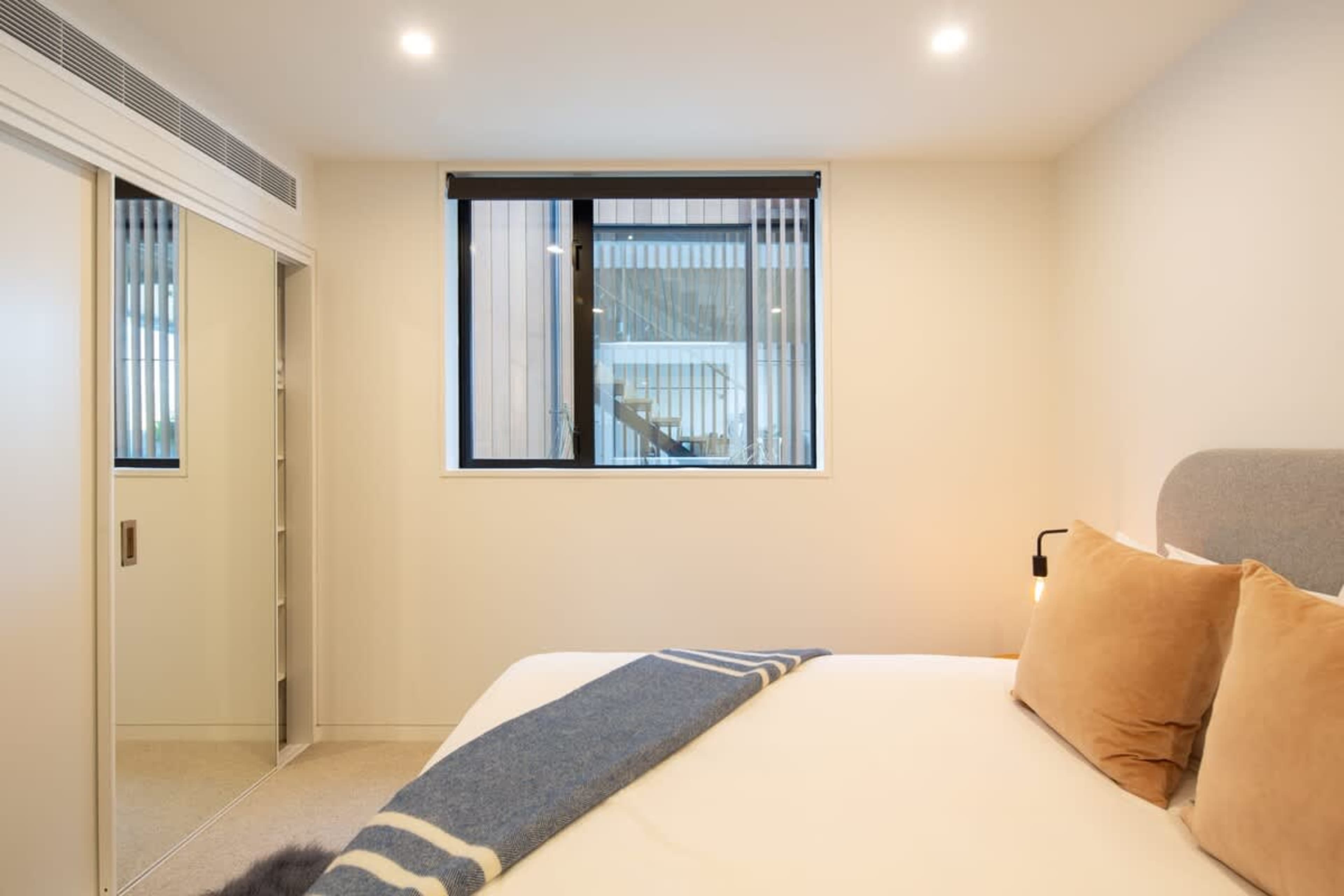 Comfortable Fourth Bedroom with King Bed – Enjoy ultimate comfort in this well-appointed bedroom, featuring a plush king bed and stylish decor for a serene and peaceful retreat.