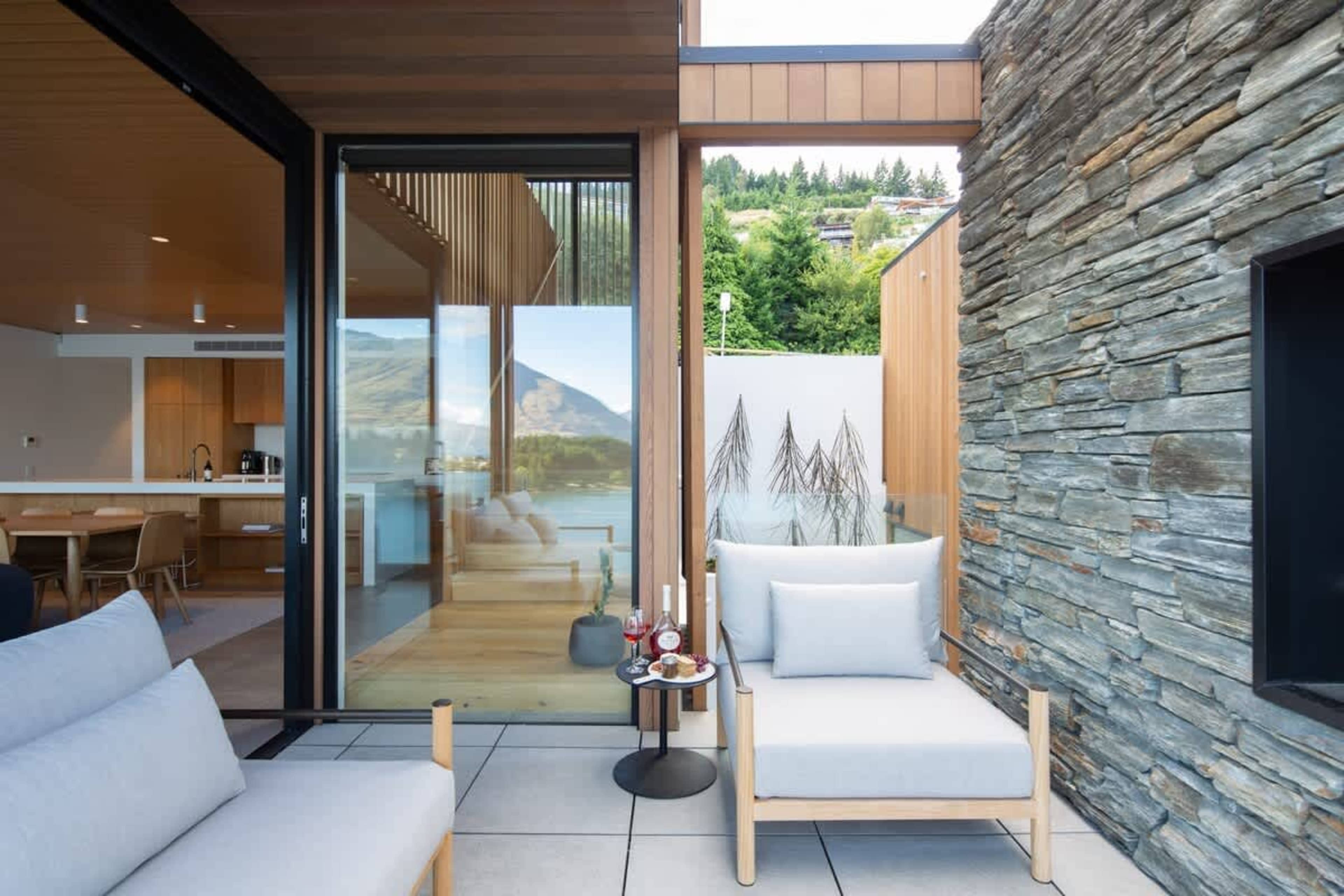 Inviting Patio with Outdoor Fireplace – The patio features a beautiful outdoor fireplace, offering a warm and cozy setting with magnificent views of the lake and surrounding landscape.