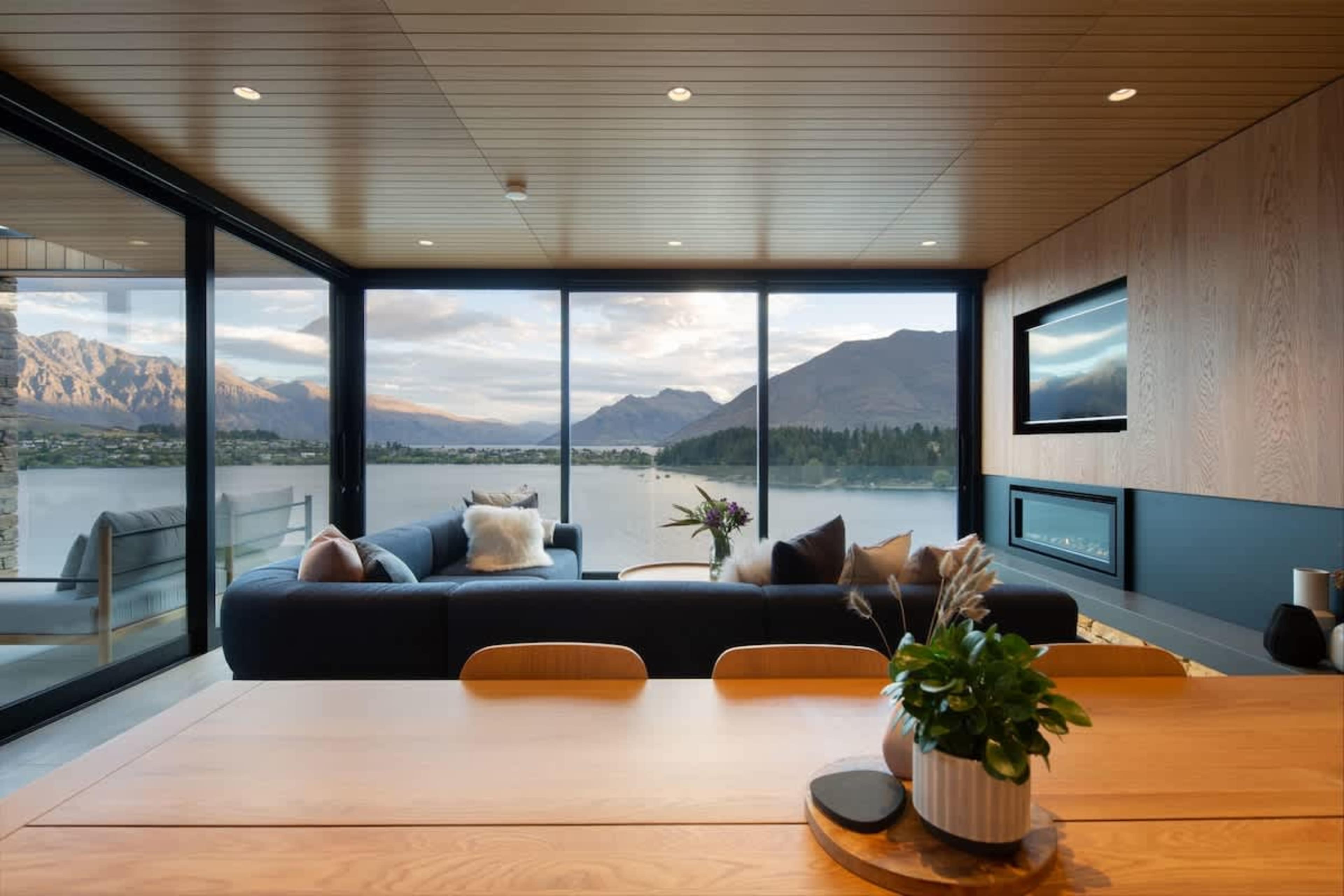 Spacious Dining Area with Scenic Backdrop – This inviting dining space offers ample seating and incredible lake views, making every meal an unforgettable experience.