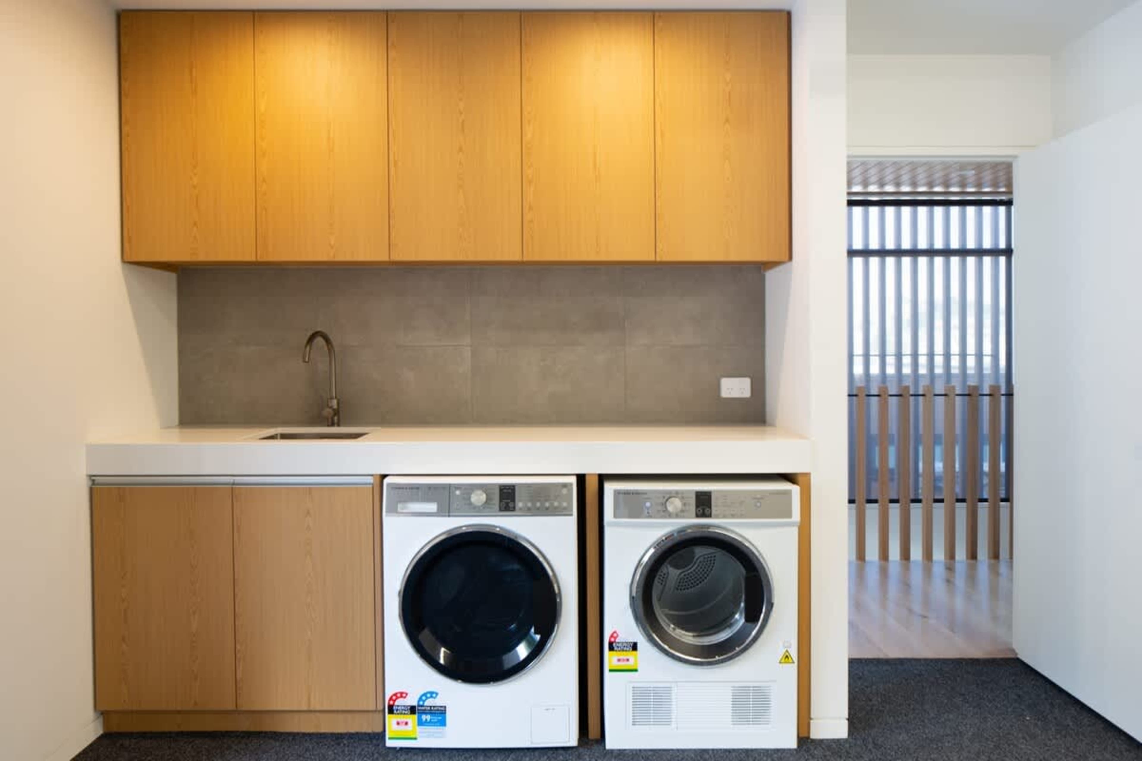 
Convenient Laundry Room – This well-equipped laundry room features modern appliances, including a washer and dryer, making it easy to refresh your clothes during your stay.