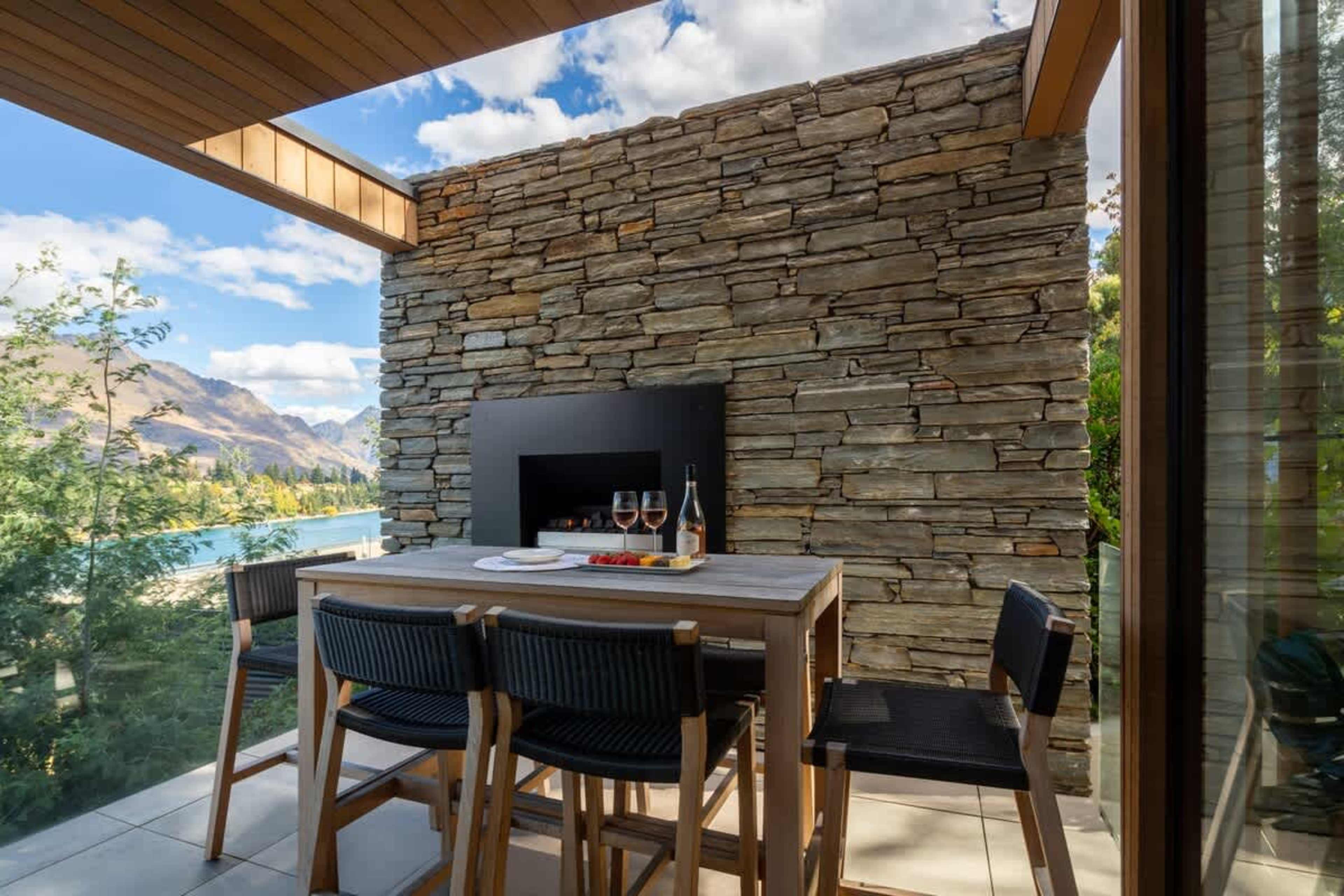 Scenic Patio with Outdoor Fireplace – Enjoy al fresco dining or unwind by the fireplace, all while overlooking the stunning views of the lake and surrounding landscape.