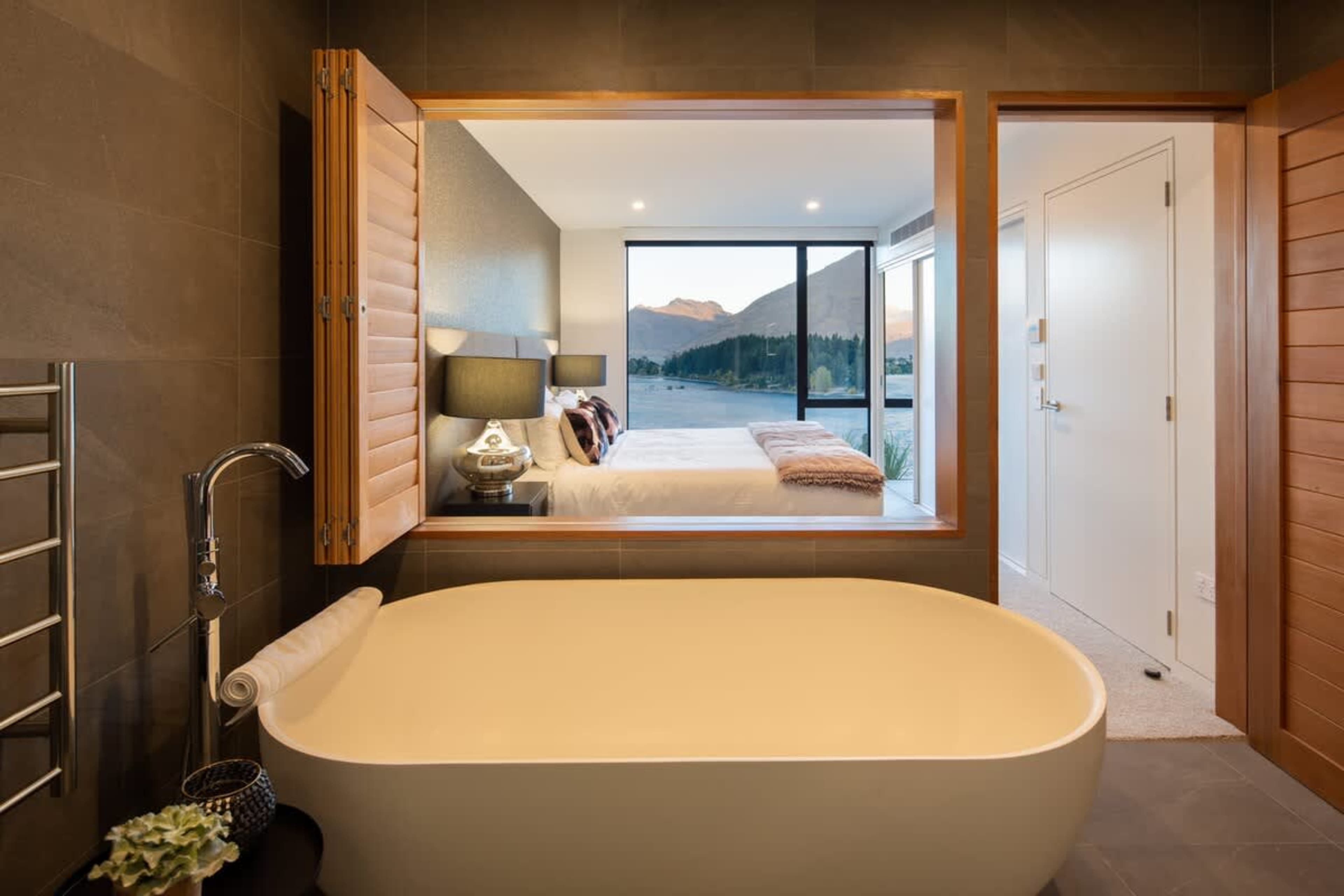 Elegant Master Bathroom – This luxurious ensuite features a spa tub, heated floors, and Ashley & Co toiletries, creating a perfect retreat for unwinding after a day of exploration.