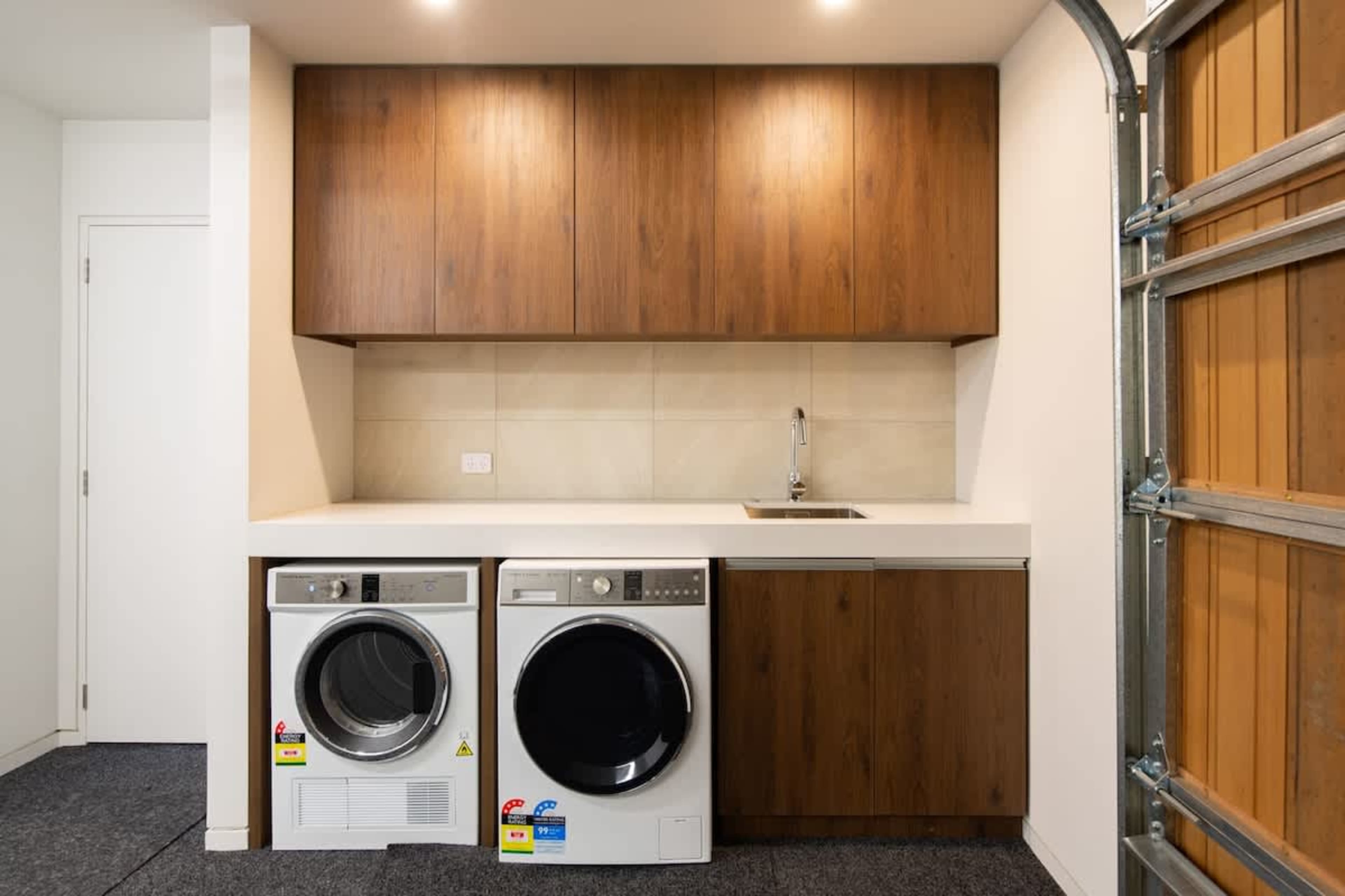 Convenient Laundry Room – This well-equipped laundry room features modern appliances, including a washer and dryer, making it easy to refresh your clothes during your stay.