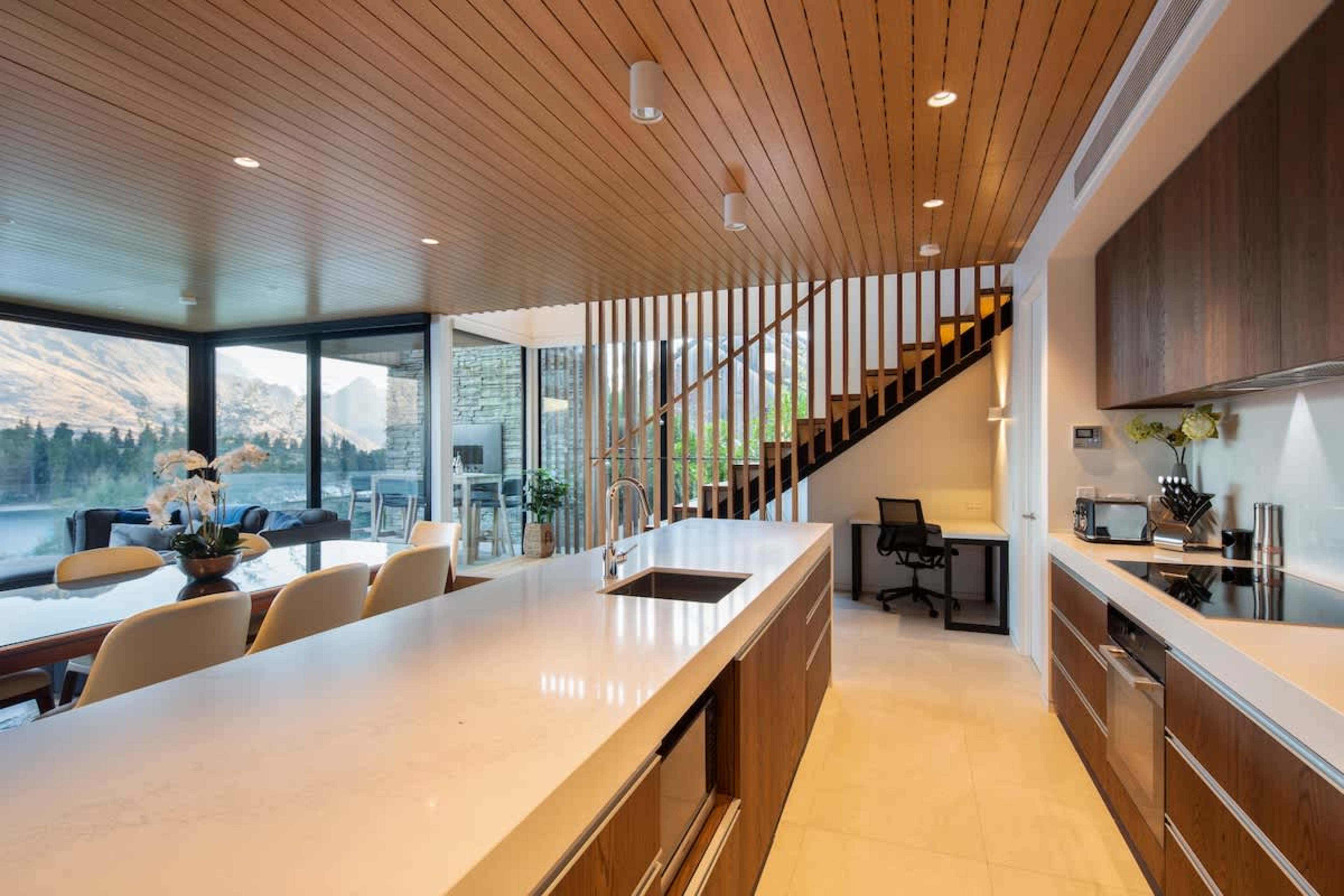 Sleek and Stylish Kitchen – Enjoy cooking in this modern kitchen, complete with top-of-the-line appliances and a Nespresso machine for your convenience, all while taking in the stunning views.