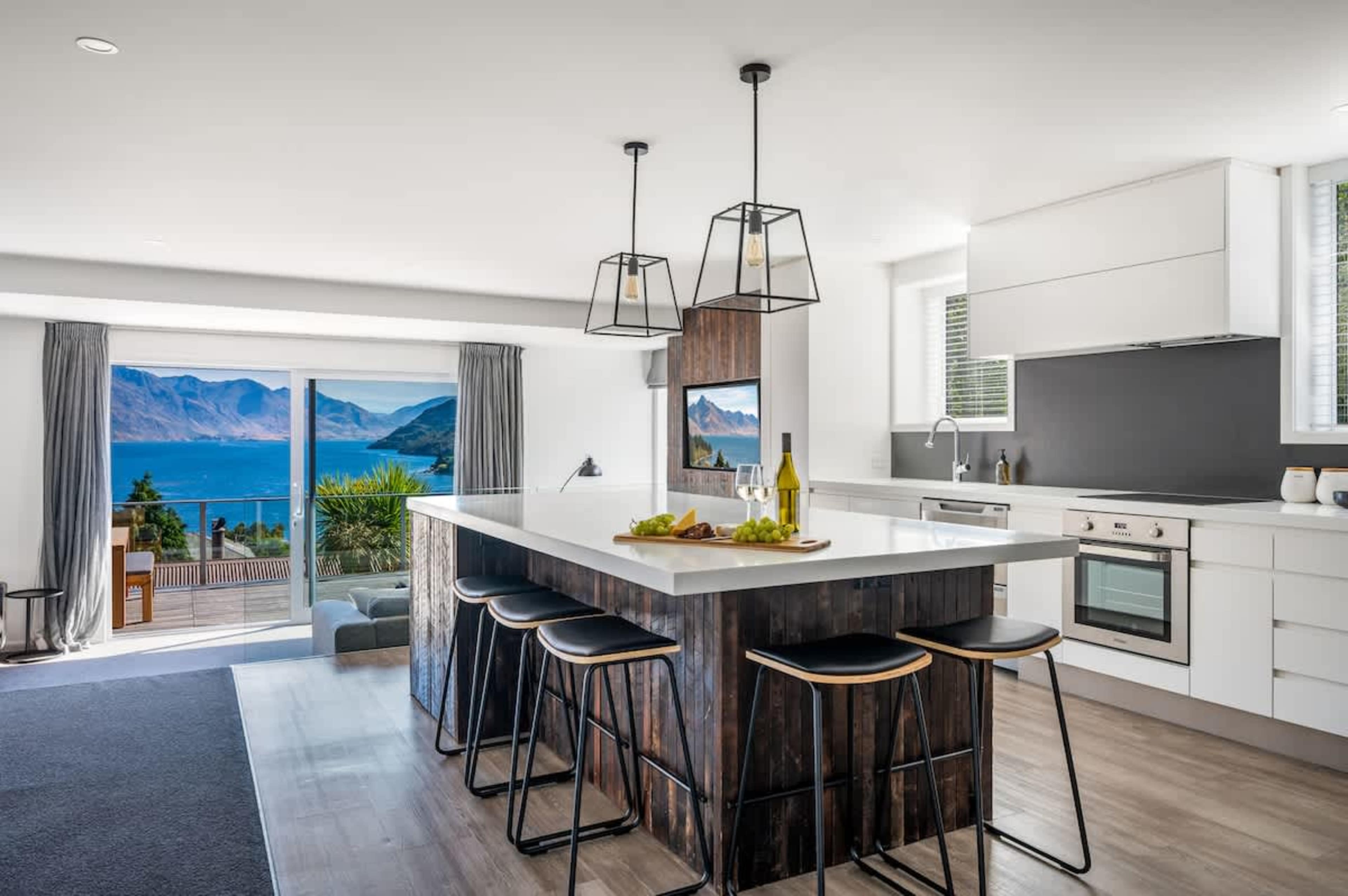 Stylish and functional kitchen in your Queenstown holiday home—includes coffee machine and everything you need to dine in.