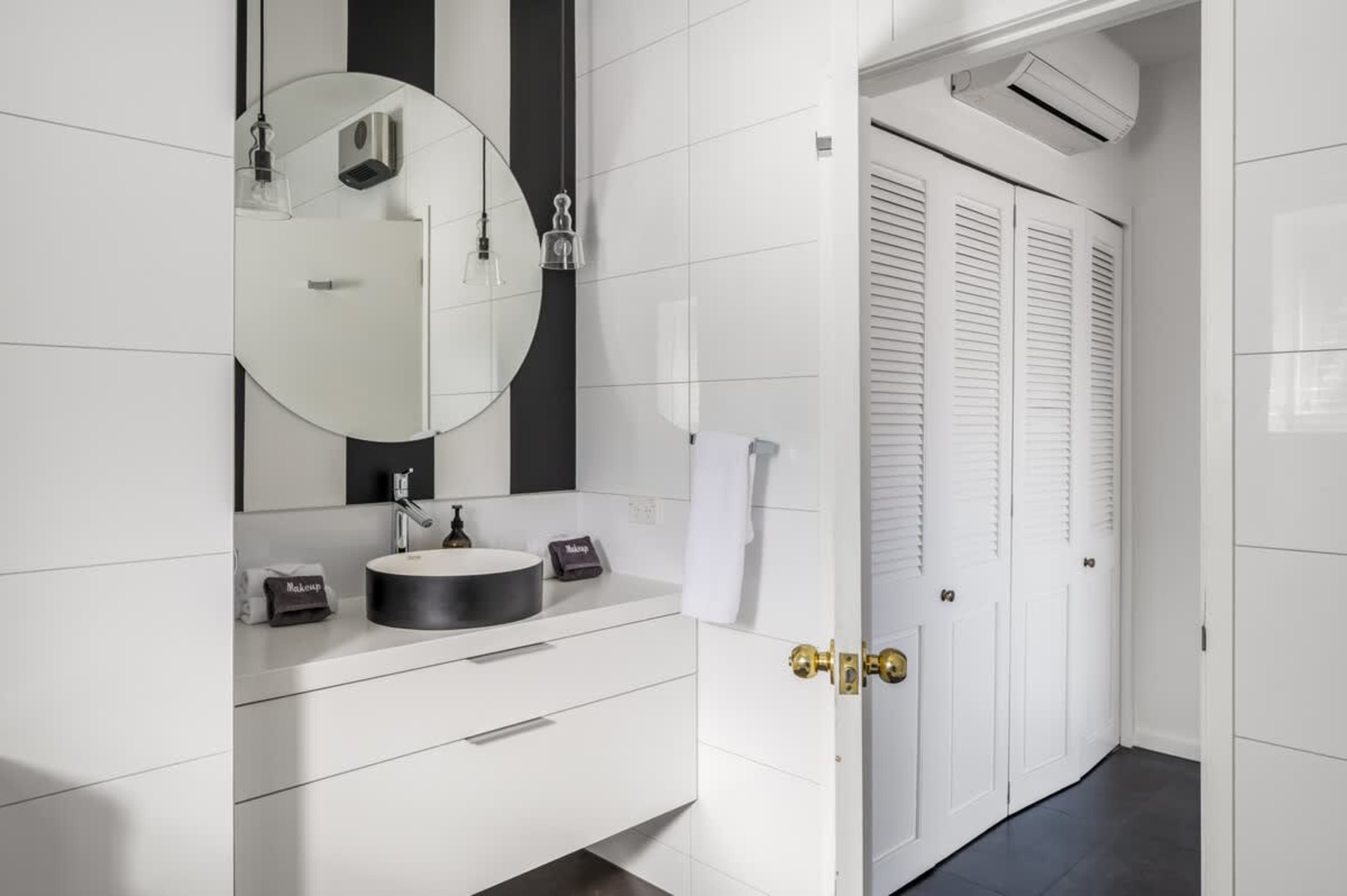 Relax in style with a sleek ensuite, heated floors, and premium Ashley & Co. toiletries—adding a touch of luxury to your Queenstown getaway.