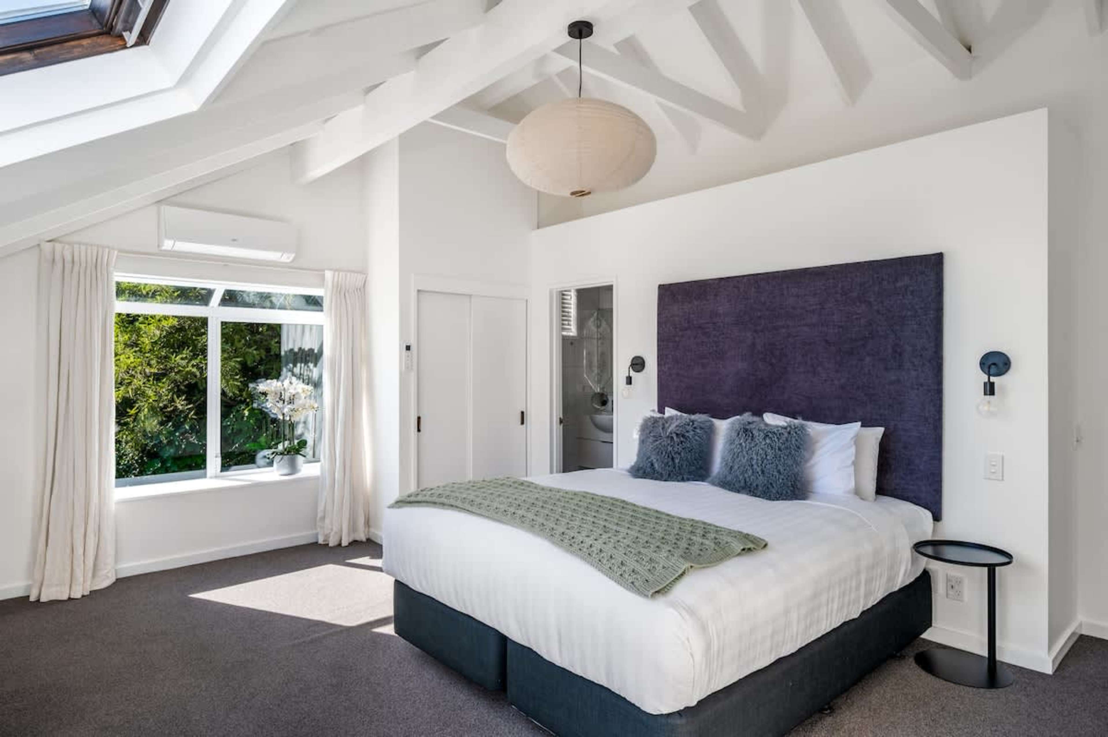 Wake up in comfort with crisp hotel-style linen and views of Lake Wakatipu—your perfect Queenstown base for adventure and relaxation.