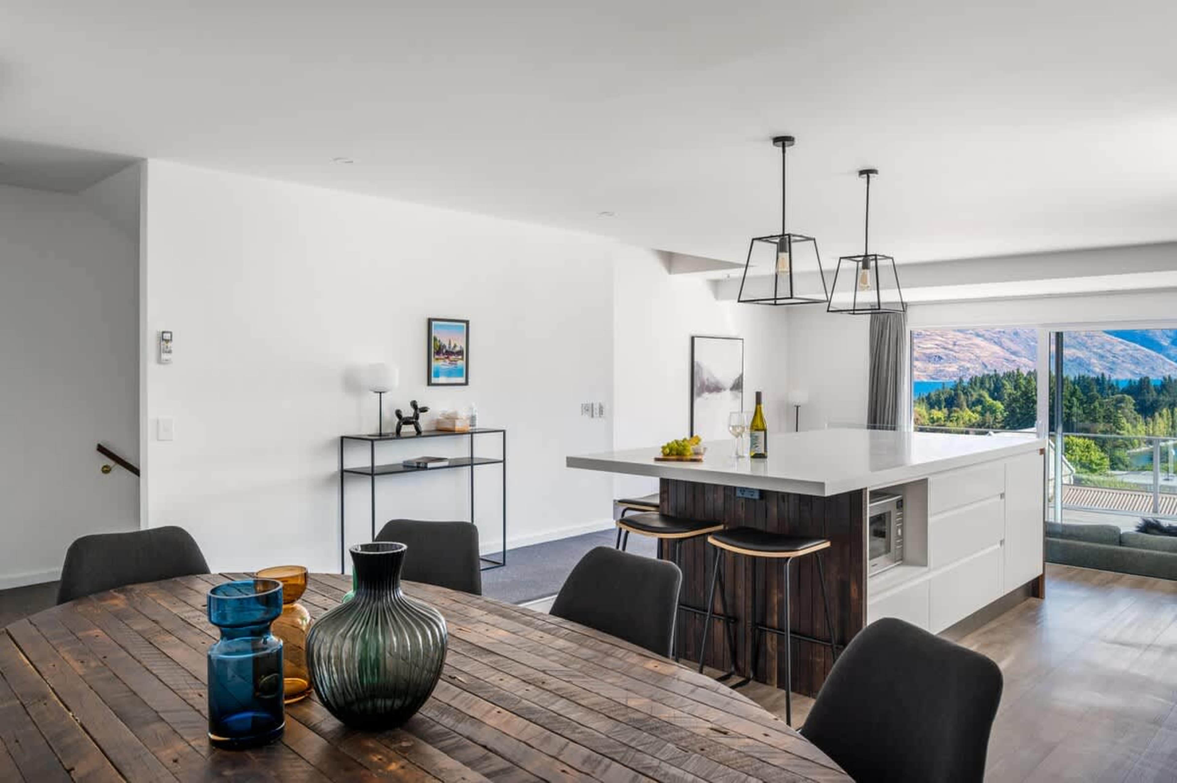 Fully stocked kitchen with quality cookware and coffee machine—ideal for family meals or entertaining in Queenstown.