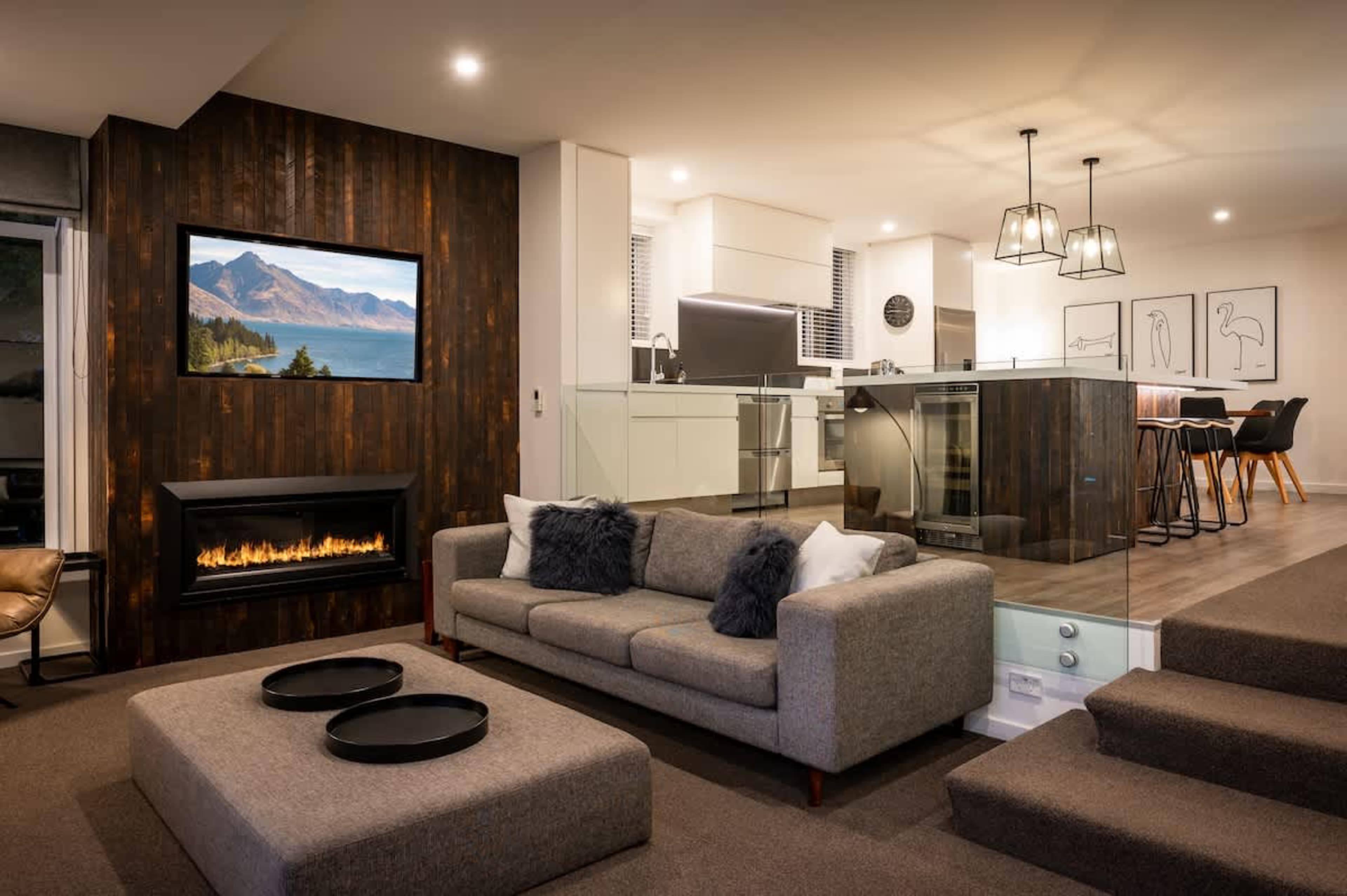 Comfortable and modern lounge overlooking The Remarkables—an ideal family-friendly base in Queenstown.