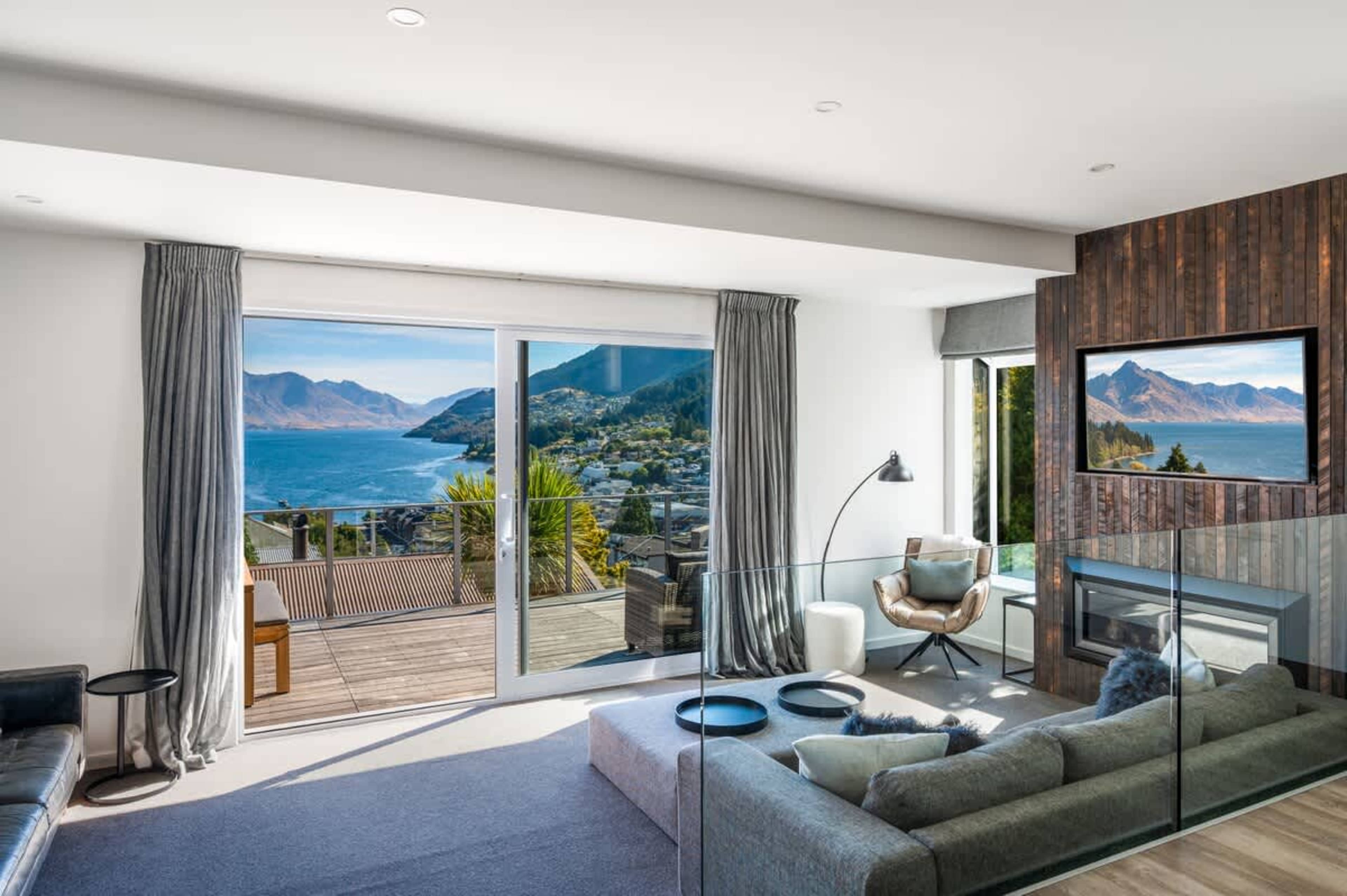 Queenstown holiday home with Netflix-ready TV, cozy seating, and postcard-perfect mountain views.