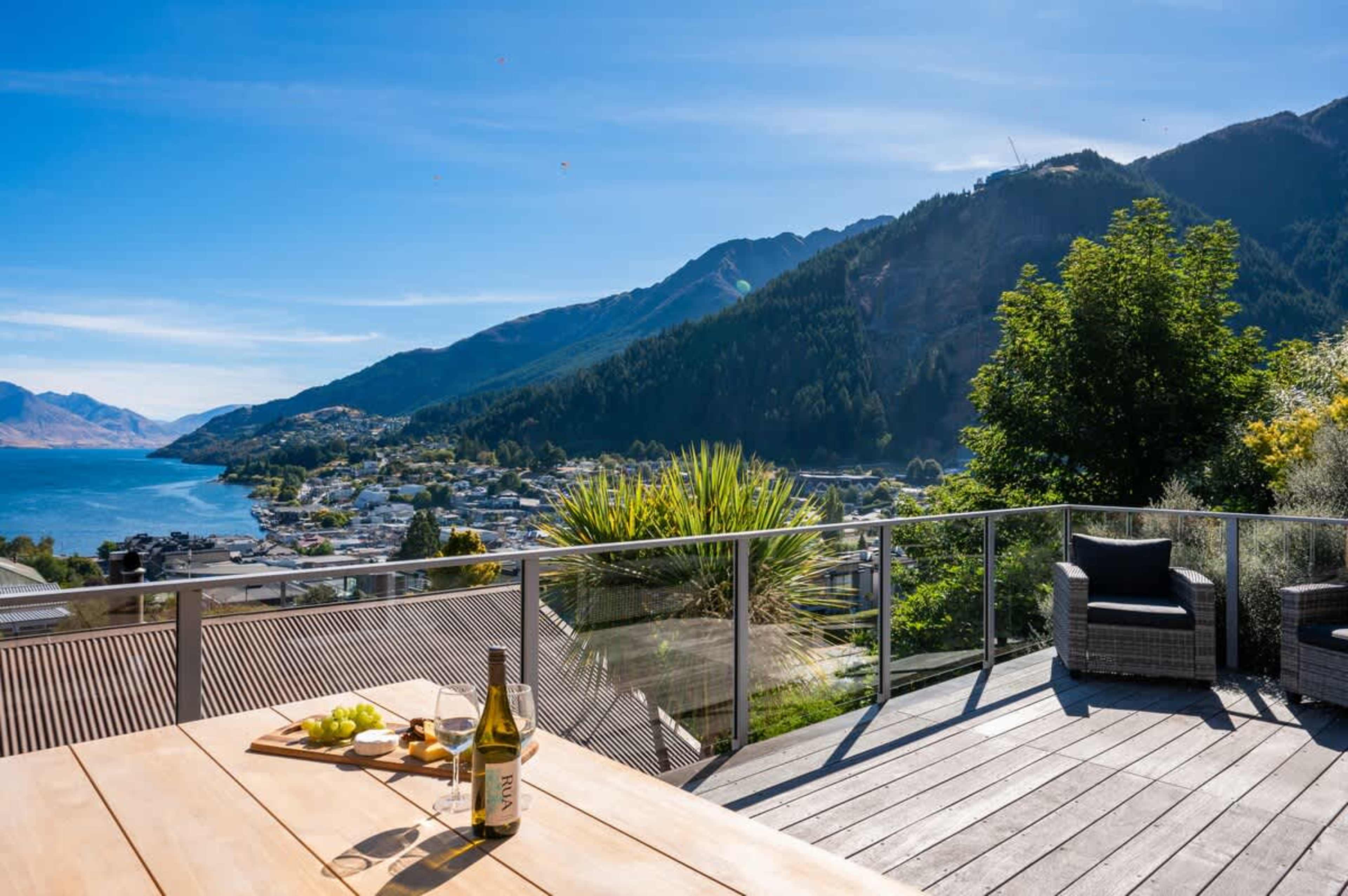 Relax on the main deck with scenic views of Lake Wakatipu and The Remarkables, perfect for unwinding after your Queenstown adventures.