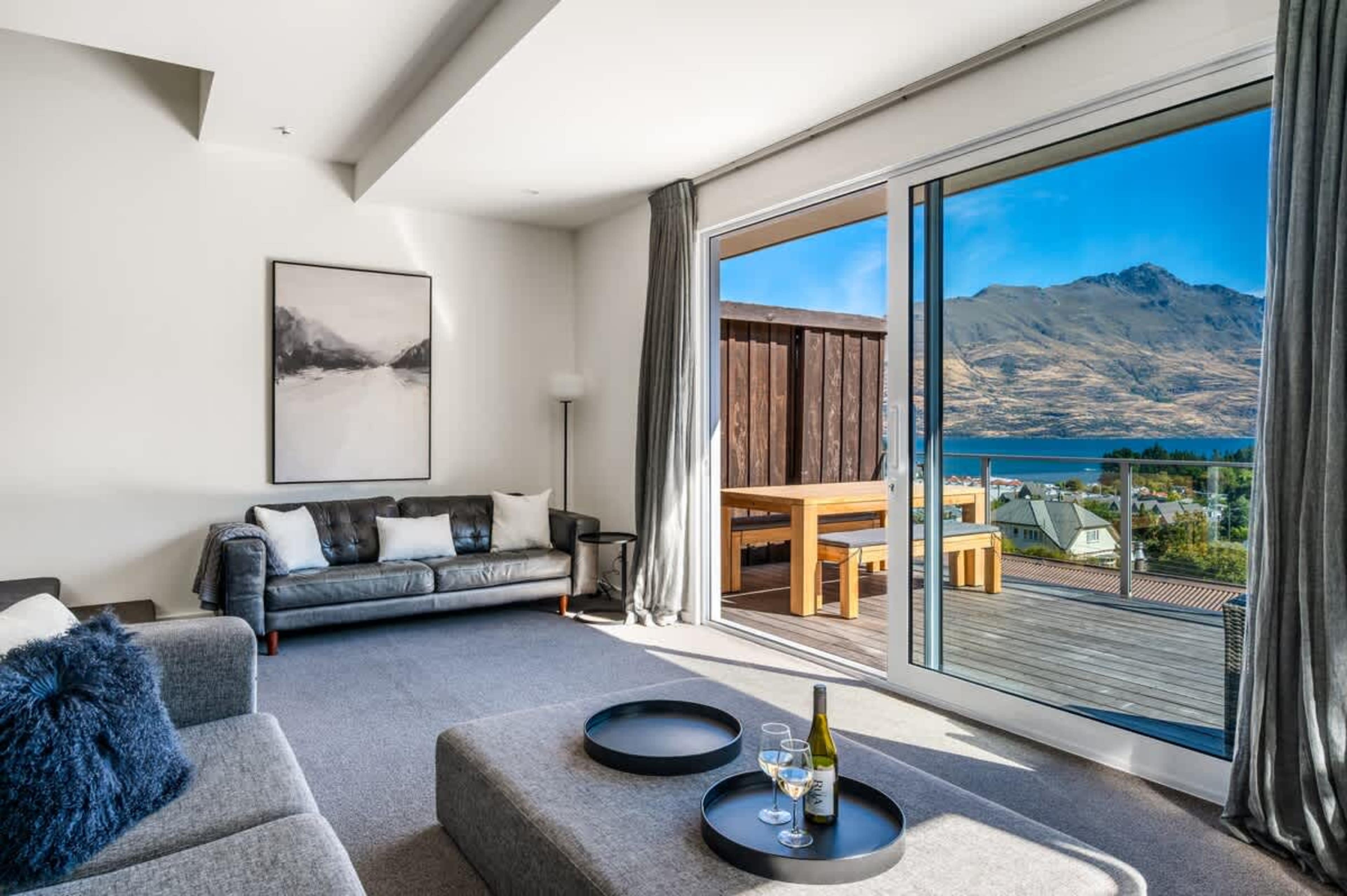 Lakeview luxury in the heart of Queenstown—gather around the fireplace after a day on the ski slopes.