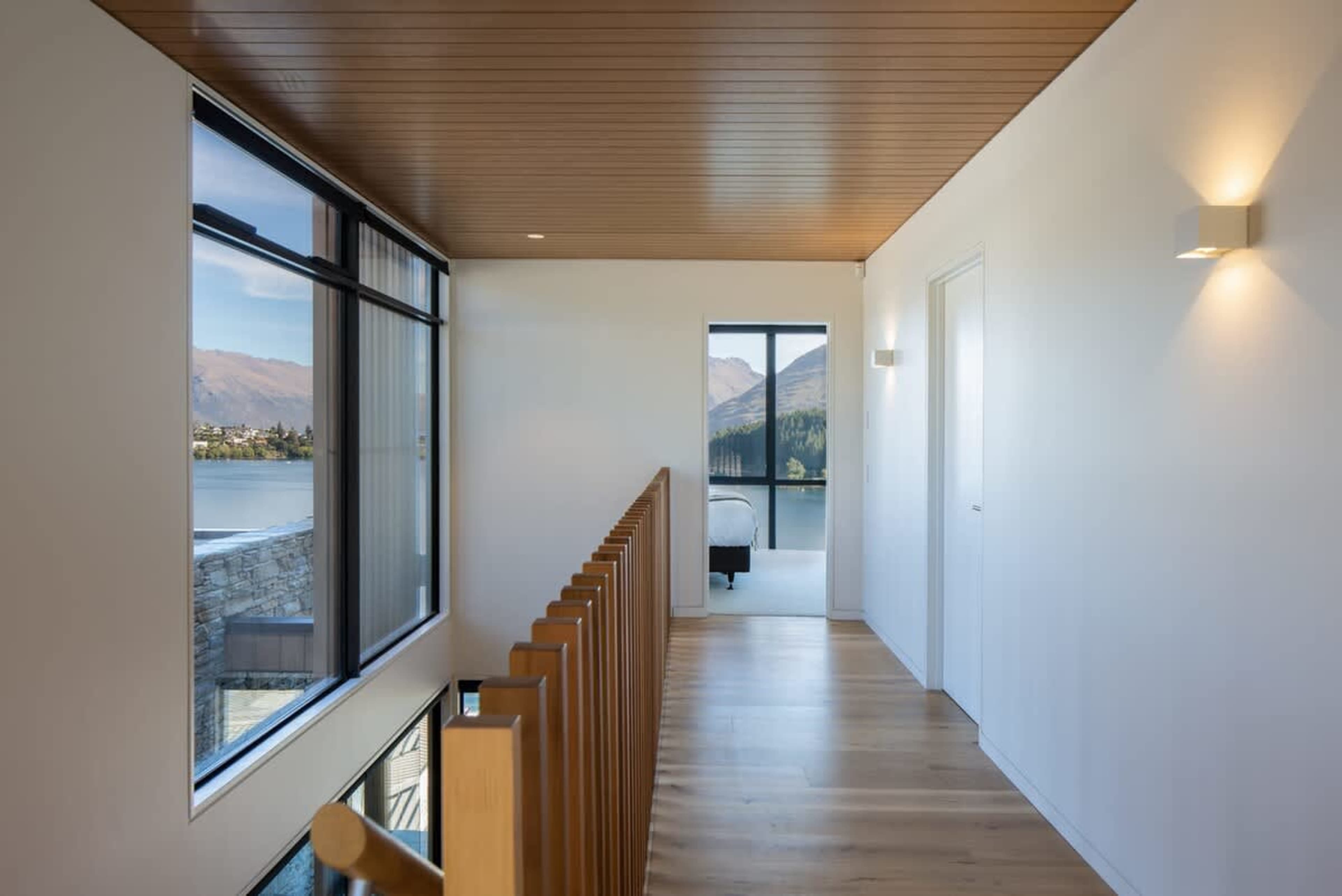 Upstairs hallway leading to inviting bedrooms in this holiday accommodation, NZ