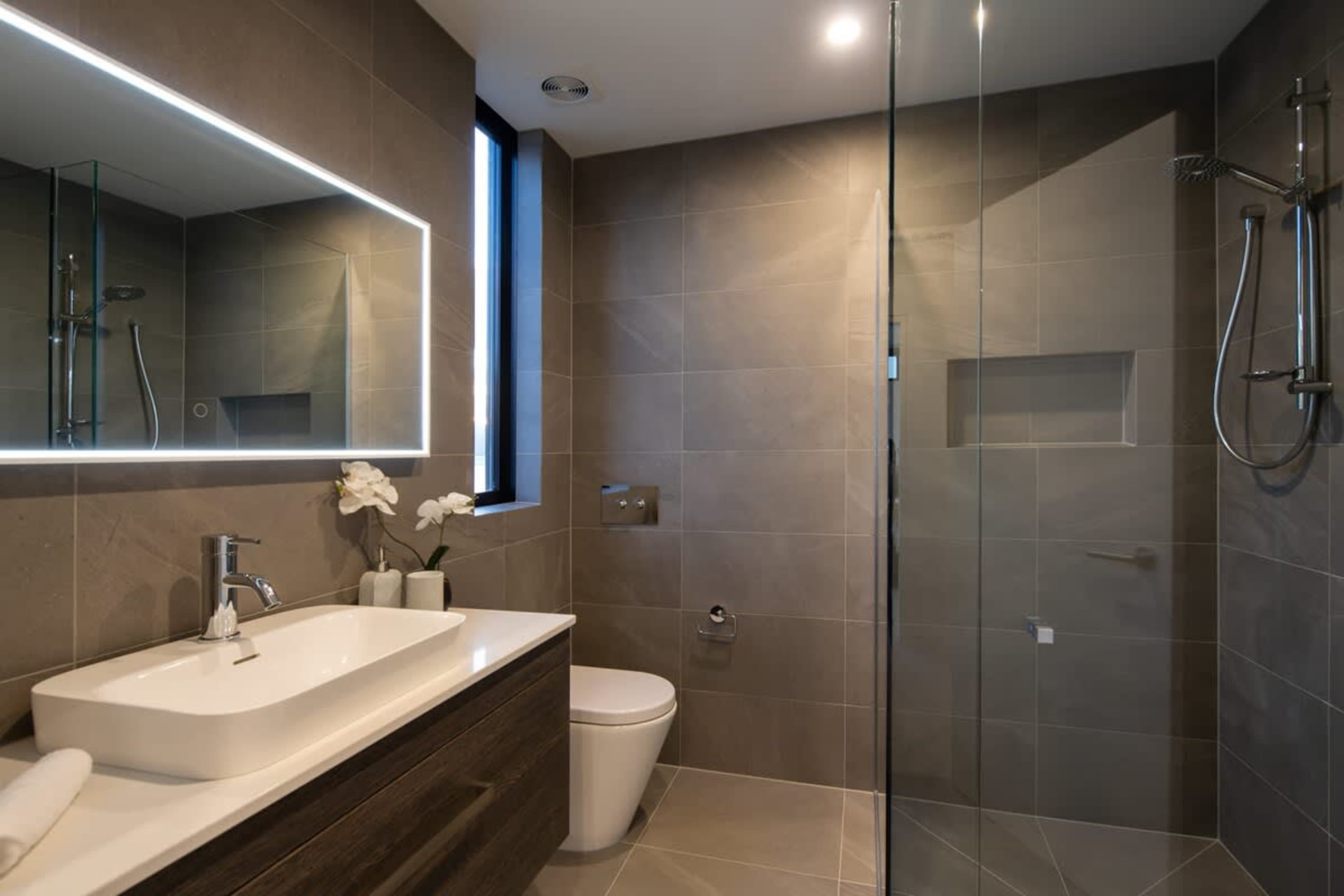 Modern Second Bathroom with Luxury Features
This stylish second bathroom offers a spacious walk-in shower, high-end fixtures, and sleek finishes. With a contemporary design and ample storage, it provides both comfort and functionality for guests.
