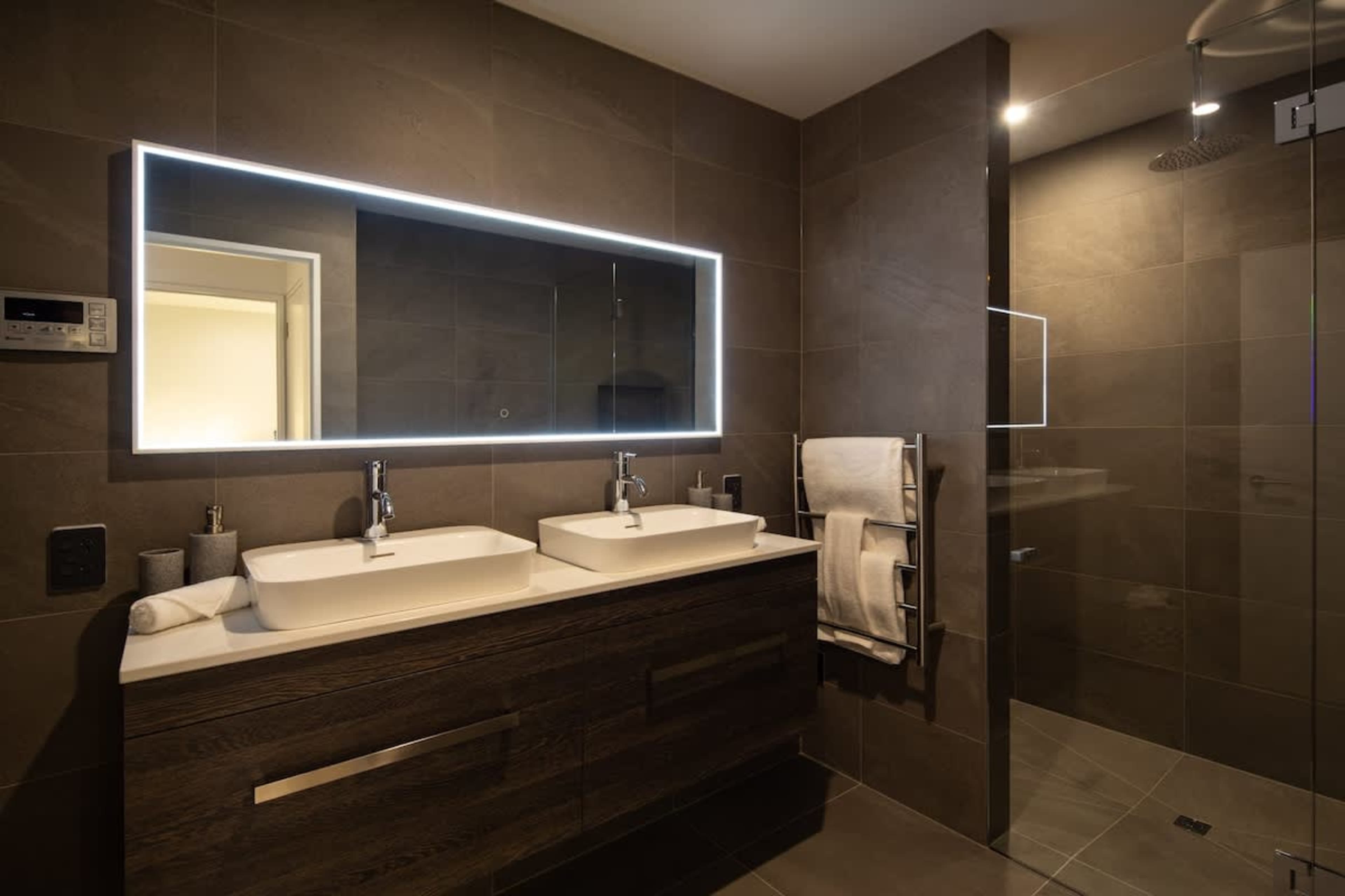 Charming Third Bathroom
This third bathroom combines style and functionality, featuring a walk-in shower, elegant fixtures, and clean, contemporary design. The perfect blend of comfort and convenience for guests, with a bright and inviting atmosphere