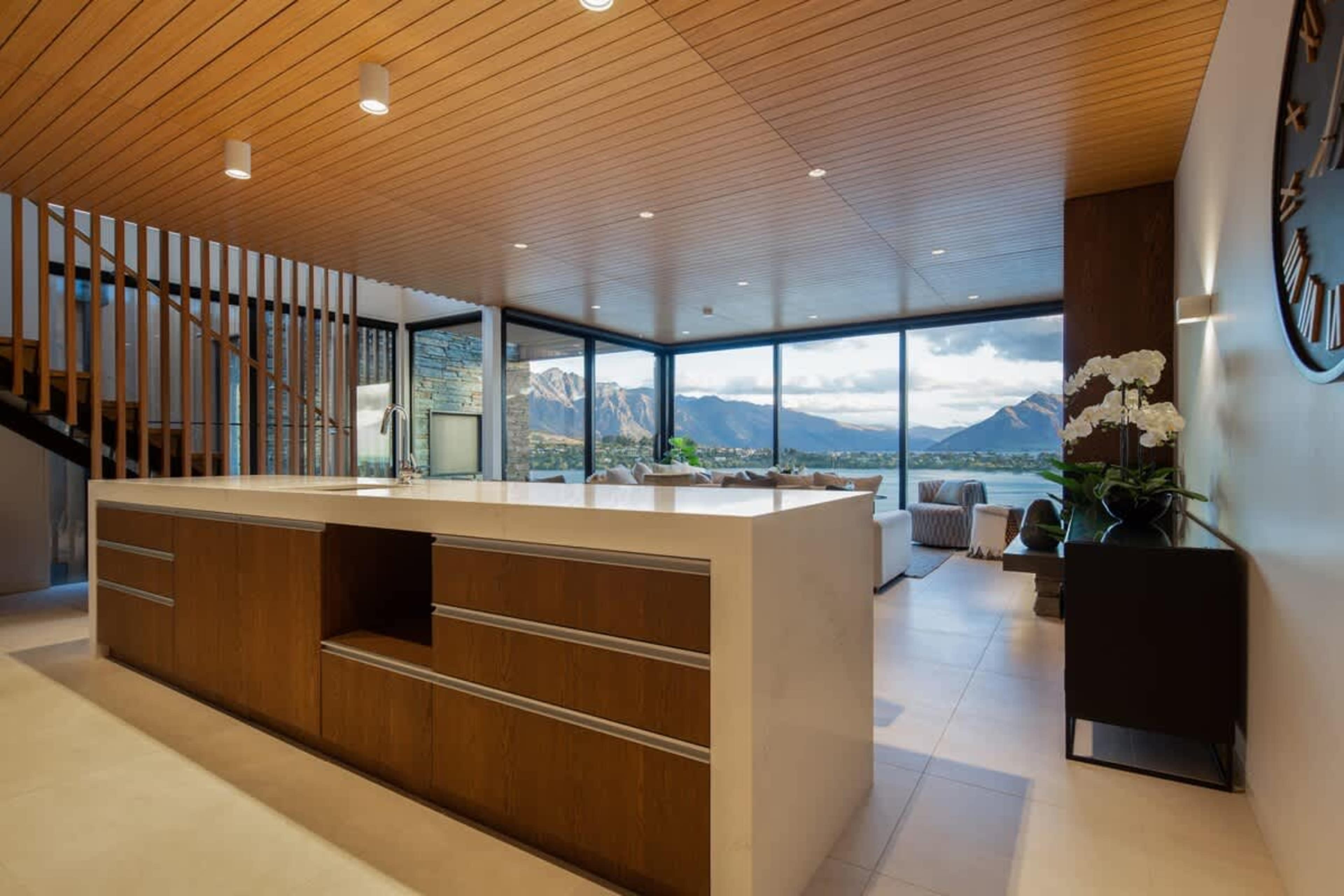 Luxury and Convenience
This contemporary kitchen offers a blend of style and practicality, featuring top-of-the-line appliances, soft-close cabinetry, and breathtaking views through expansive windows.