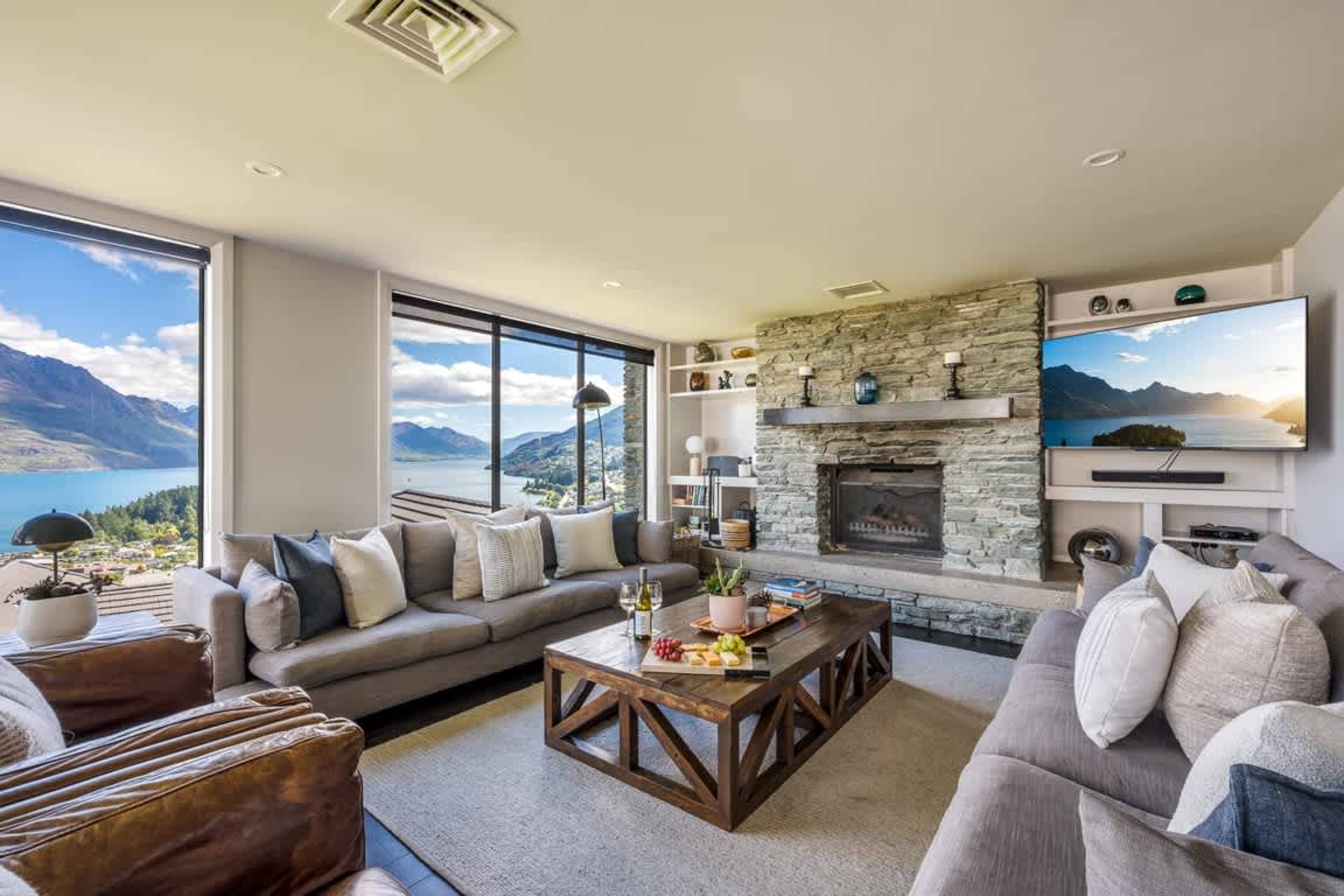 1Year-Round Comfort Enjoy air-conditioned comfort in summer and a cozy fireplace in winter, all with stunning lake and mountain views.