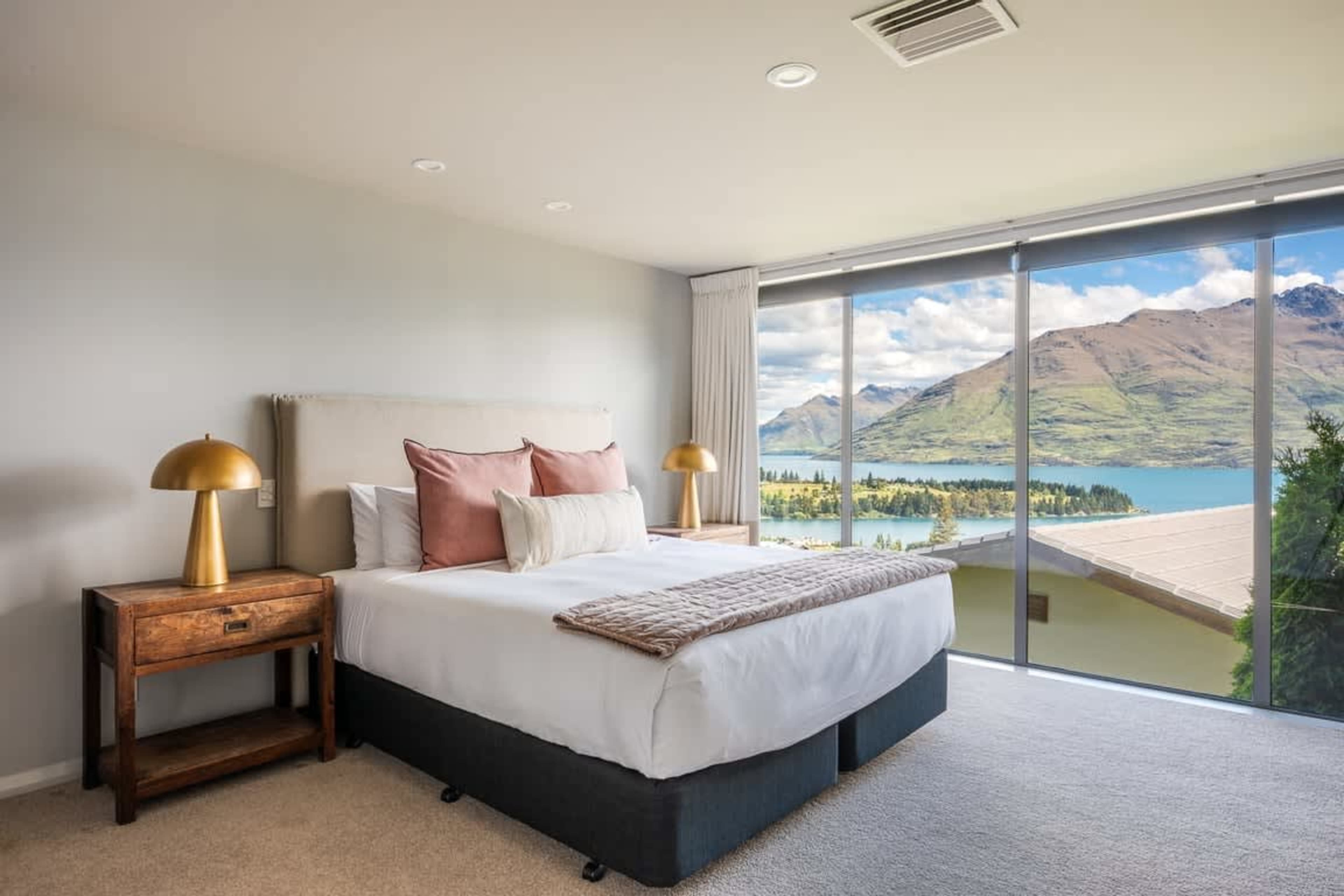 Master Suite with Views Relax in this spacious master bedroom featuring stunning lake and mountain views, plus a modern ensuite for ultimate comfort.