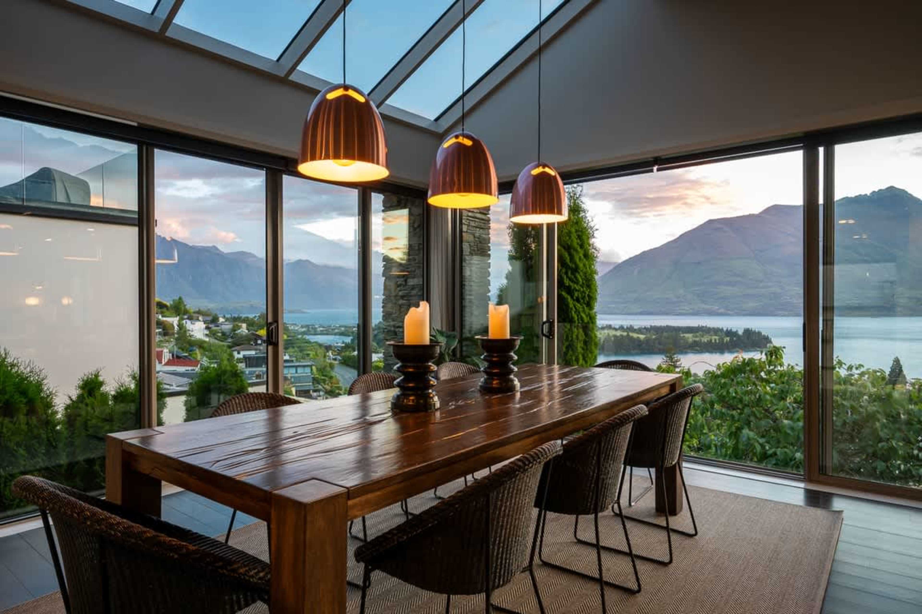 Family-Friendly Dining Share meals with loved ones in this spacious dining area, perfectly set against a backdrop of awe-inspiring lake and mountain views.