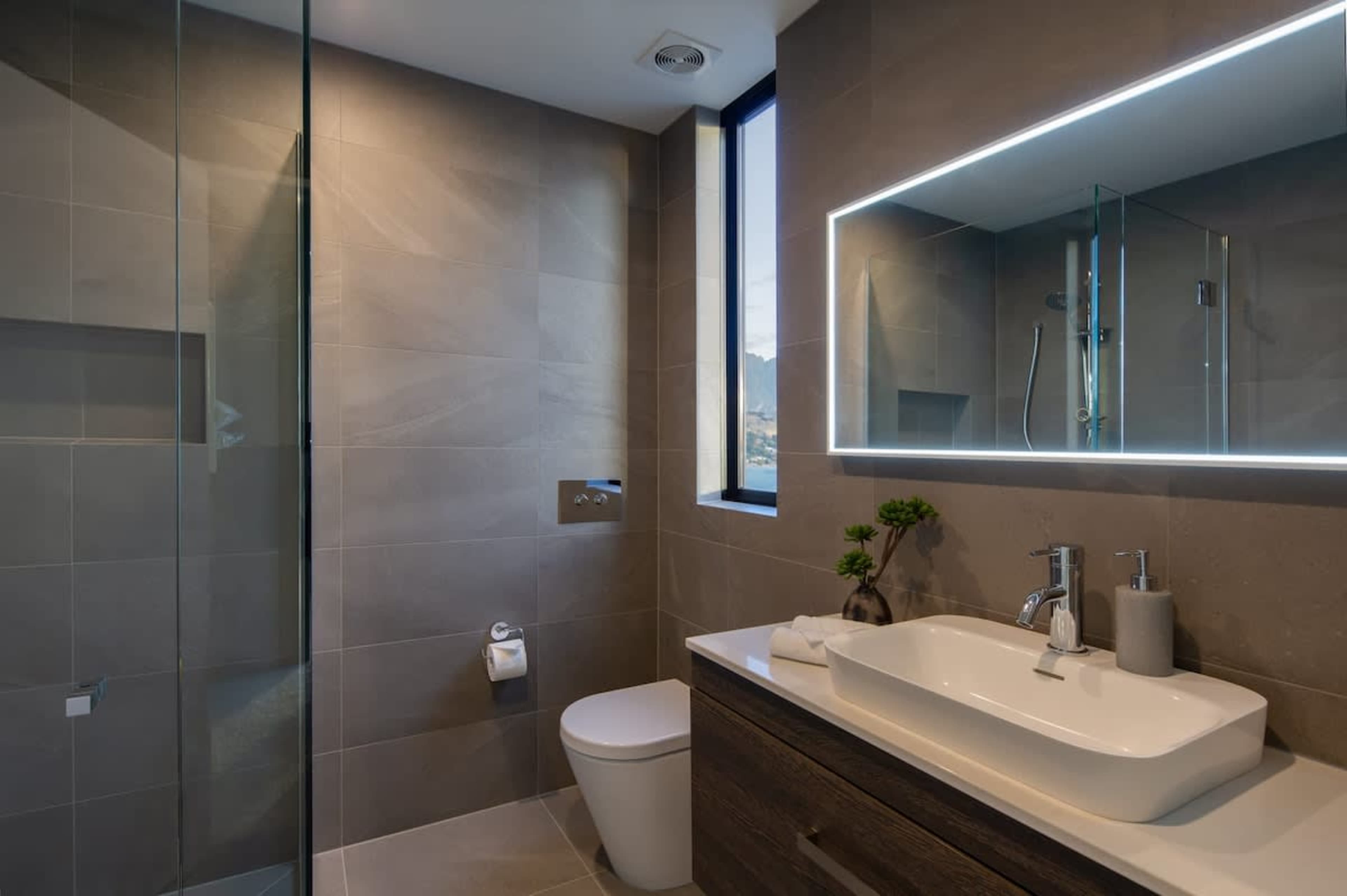 Second Bathroom - Modern and Convenient
A sleek and modern second bathroom featuring a spacious shower, elegant finishes, and all the essentials for your comfort.