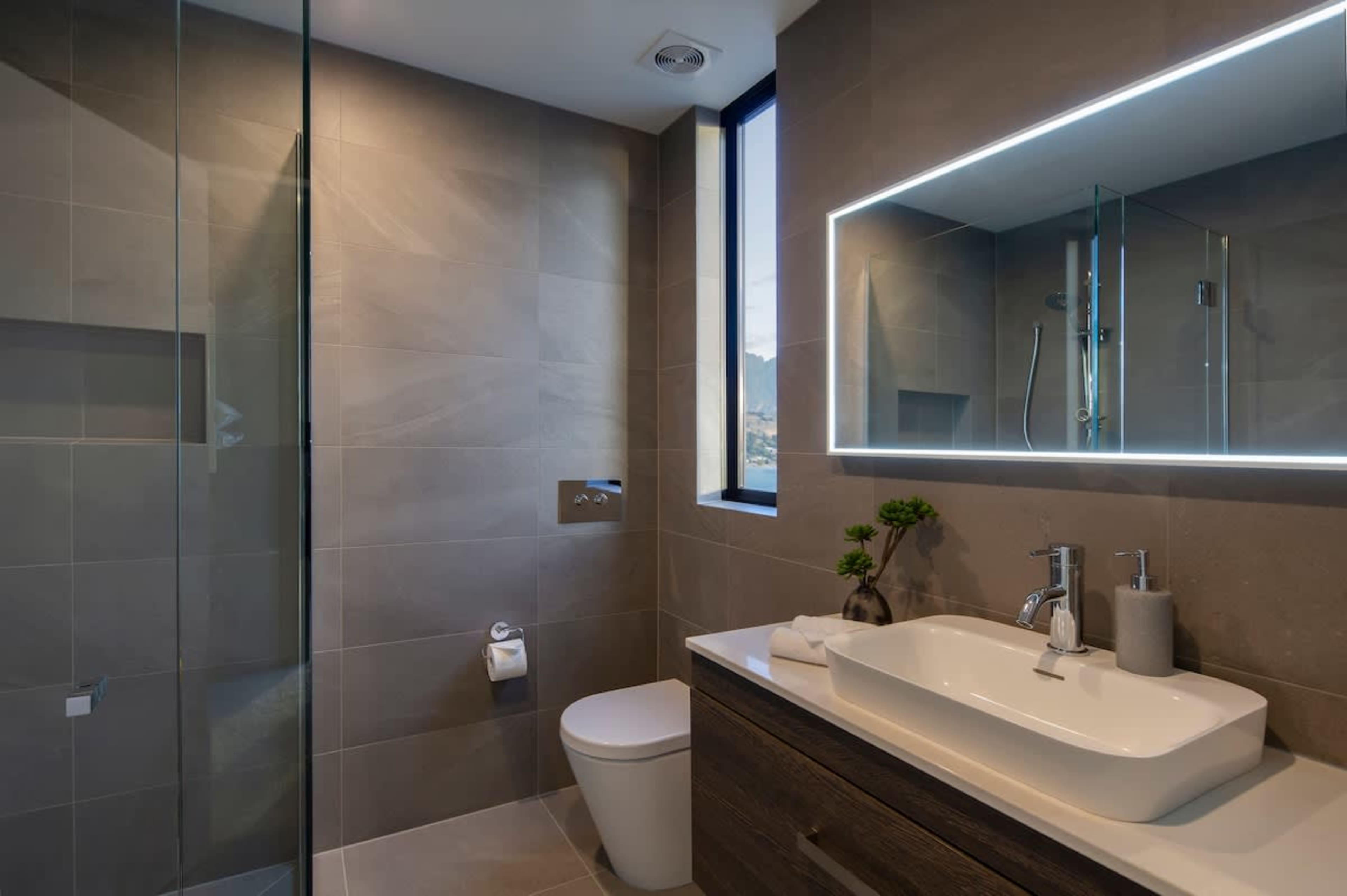 Third Bathroom - Stylish and Practical
A modern third bathroom with a walk-in shower, contemporary design, and all the amenities needed for convenience.