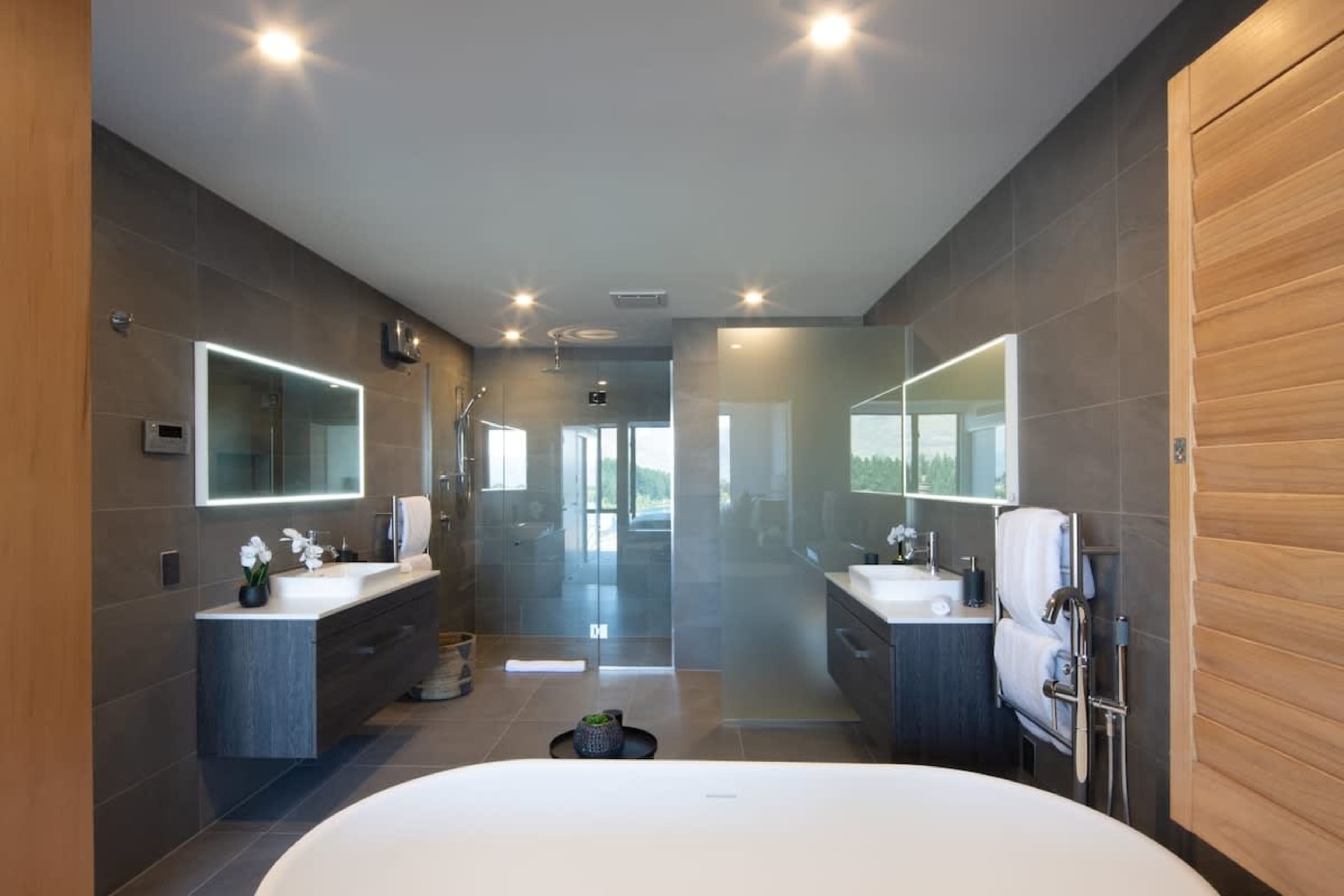 Master Bathroom - Elegant and Relaxing
This master bathroom offers heated floors, a soothing spa bath, and Ashley & Co. toiletries, creating a tranquil and luxurious escape.