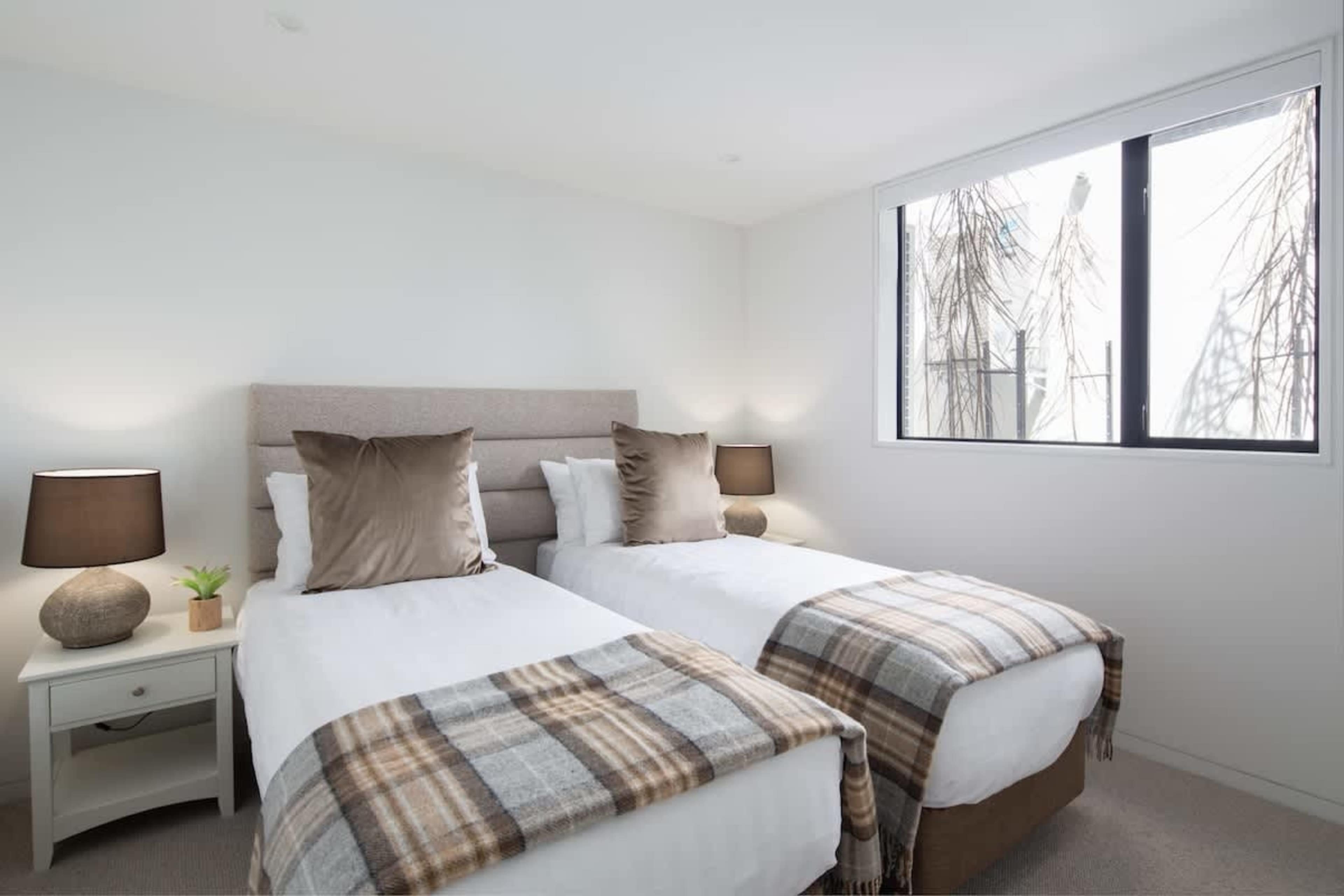 Fourth Bedroom - Flexible Comfort
A versatile fourth bedroom with a king split bed, offering flexible sleeping arrangements and ample space for relaxation.