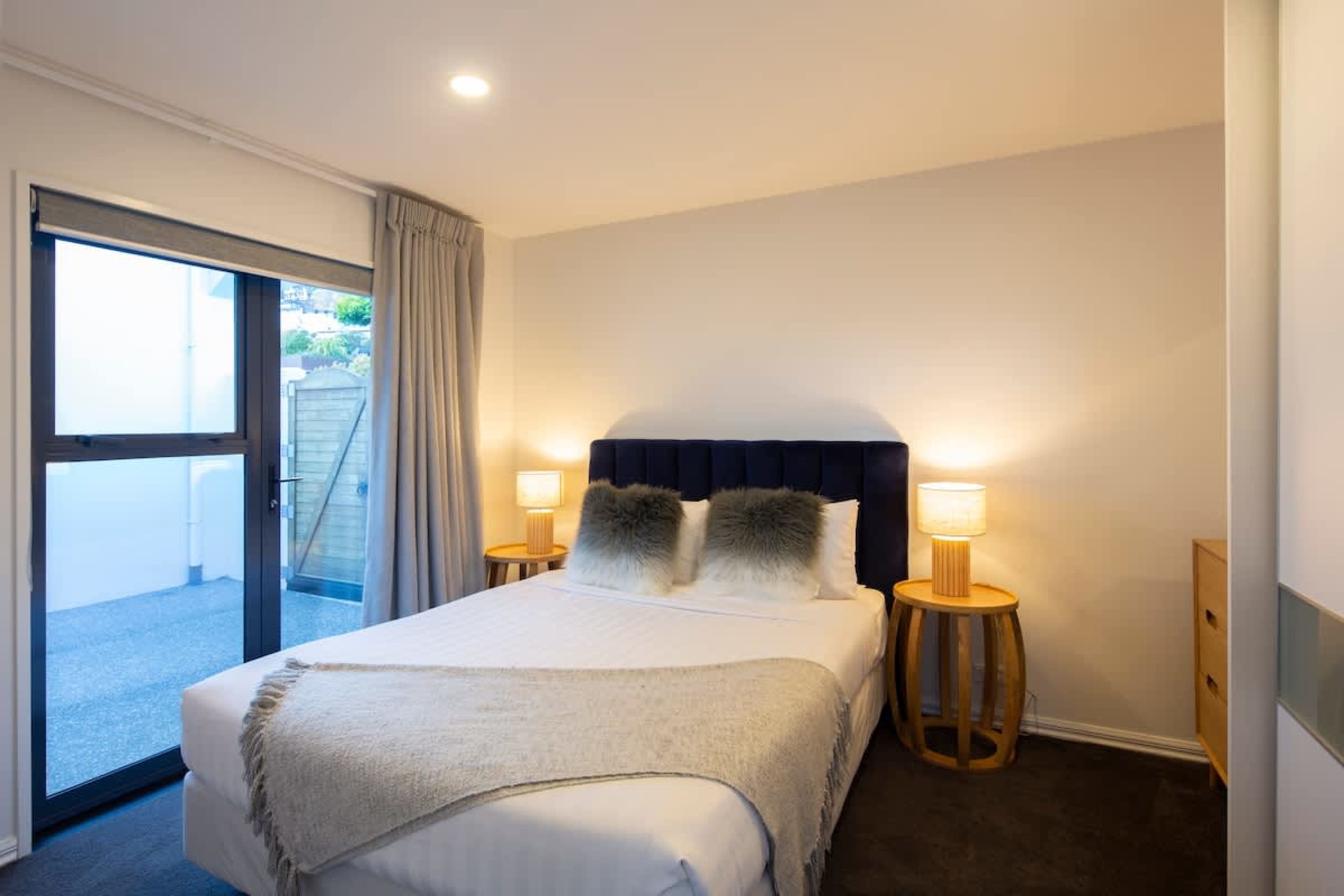 Charming Third Bedroom: Thoughtfully designed with cozy bedding and plenty of natural light, perfect for family or friends to unwind after a day in Queenstown.