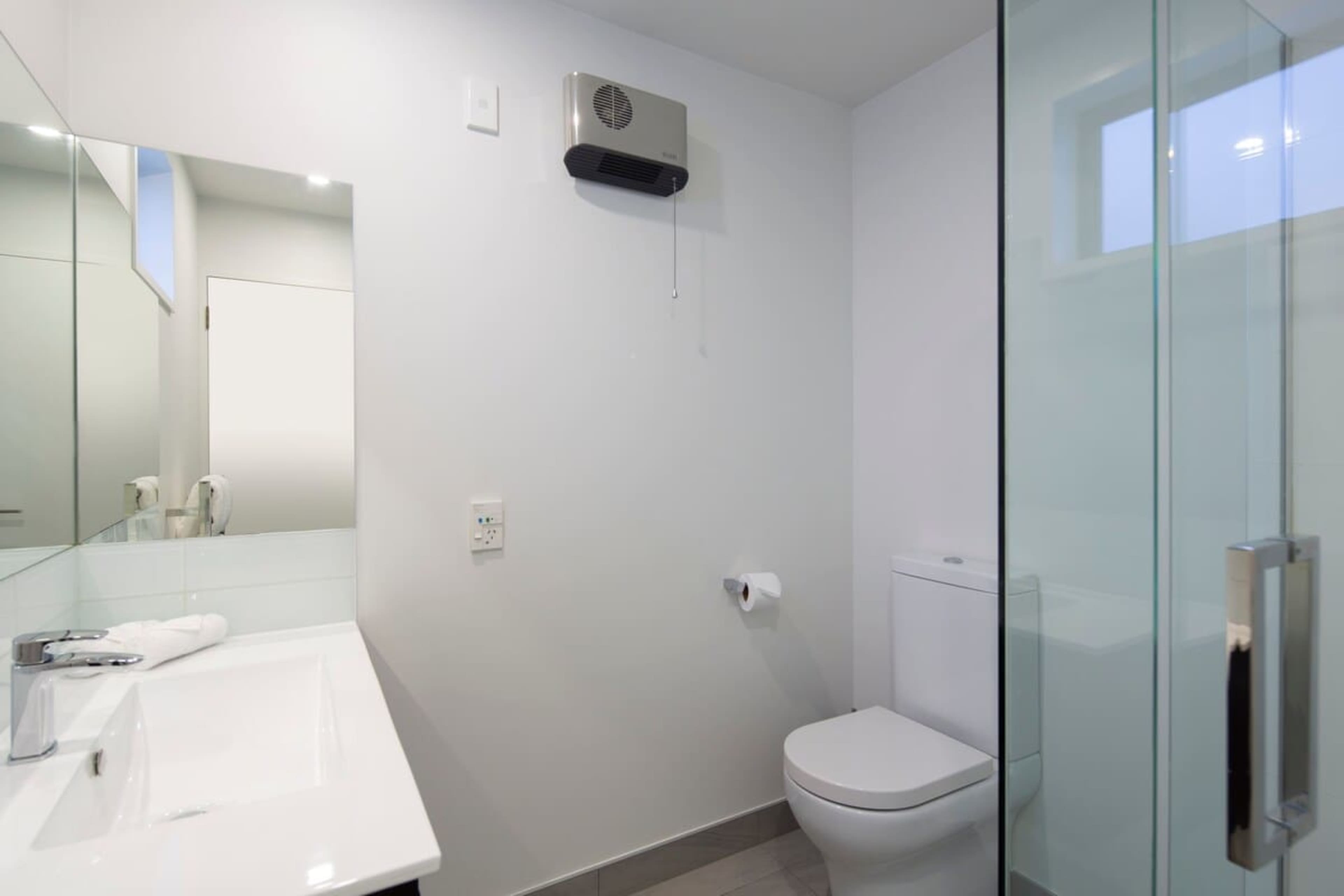 Modern and Inviting: The master ensuite features heated floors, cozy towel rails, and premium Ashley & Co products for a relaxing and rejuvenating experience.