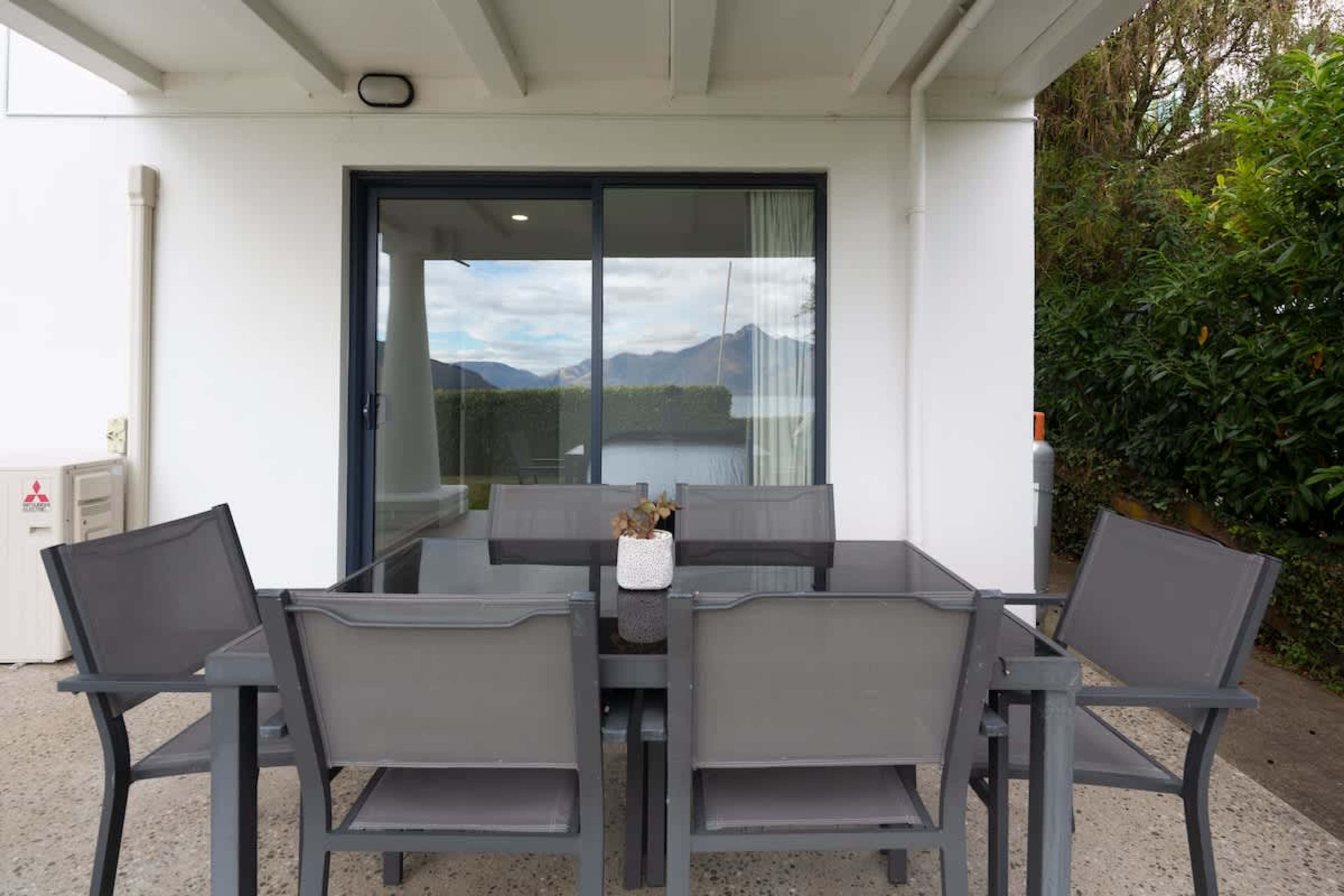 Secluded Outdoor Oasis: Relax in the private garden patio, perfect for morning coffee or evening drinks amidst lush greenery and fresh mountain air.

