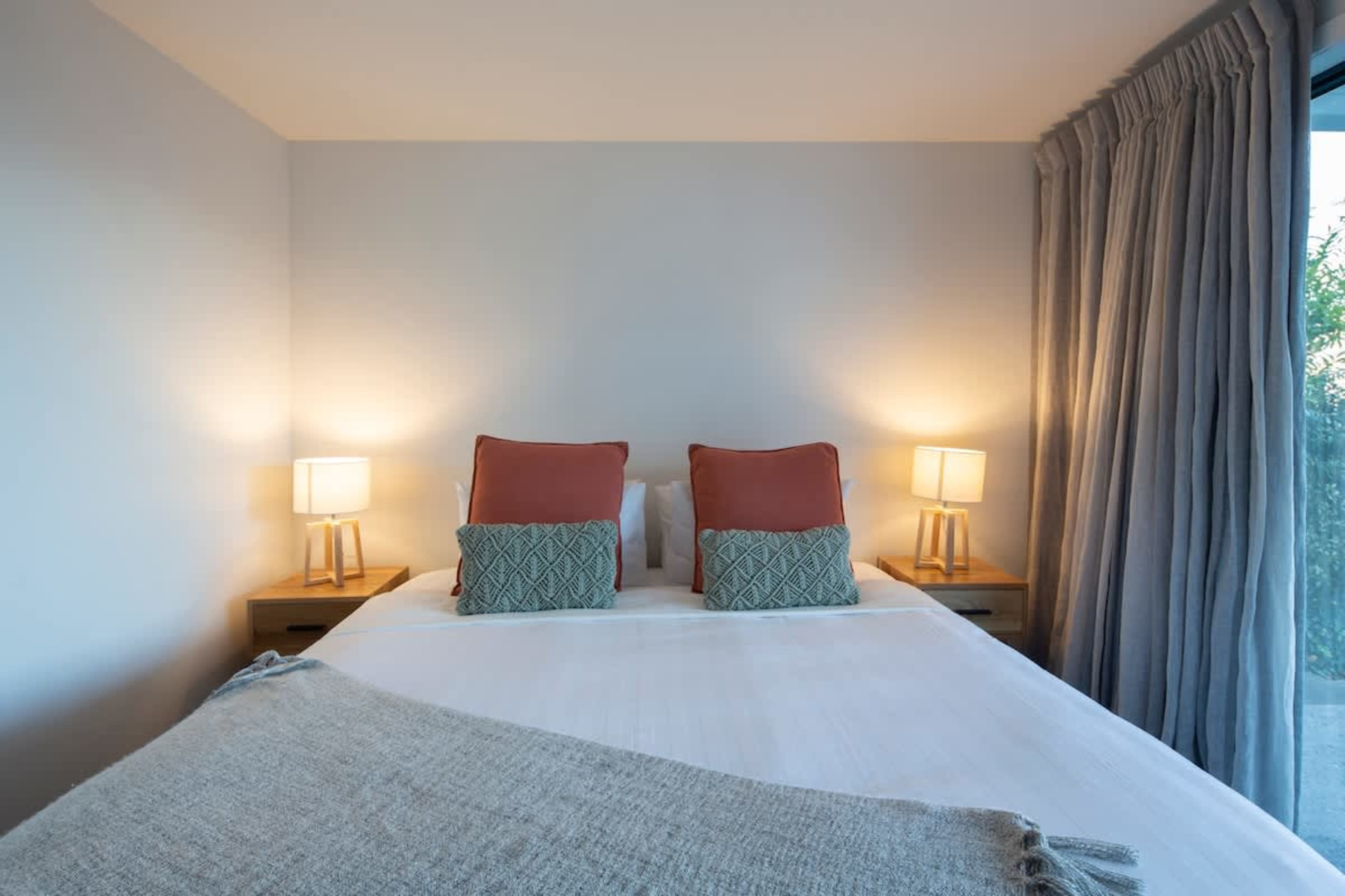 Elegant and Private: Relax in the master suite featuring a comfy king bed, ensuite bathroom, and stylish decor. Ideal for a peaceful night’s rest.