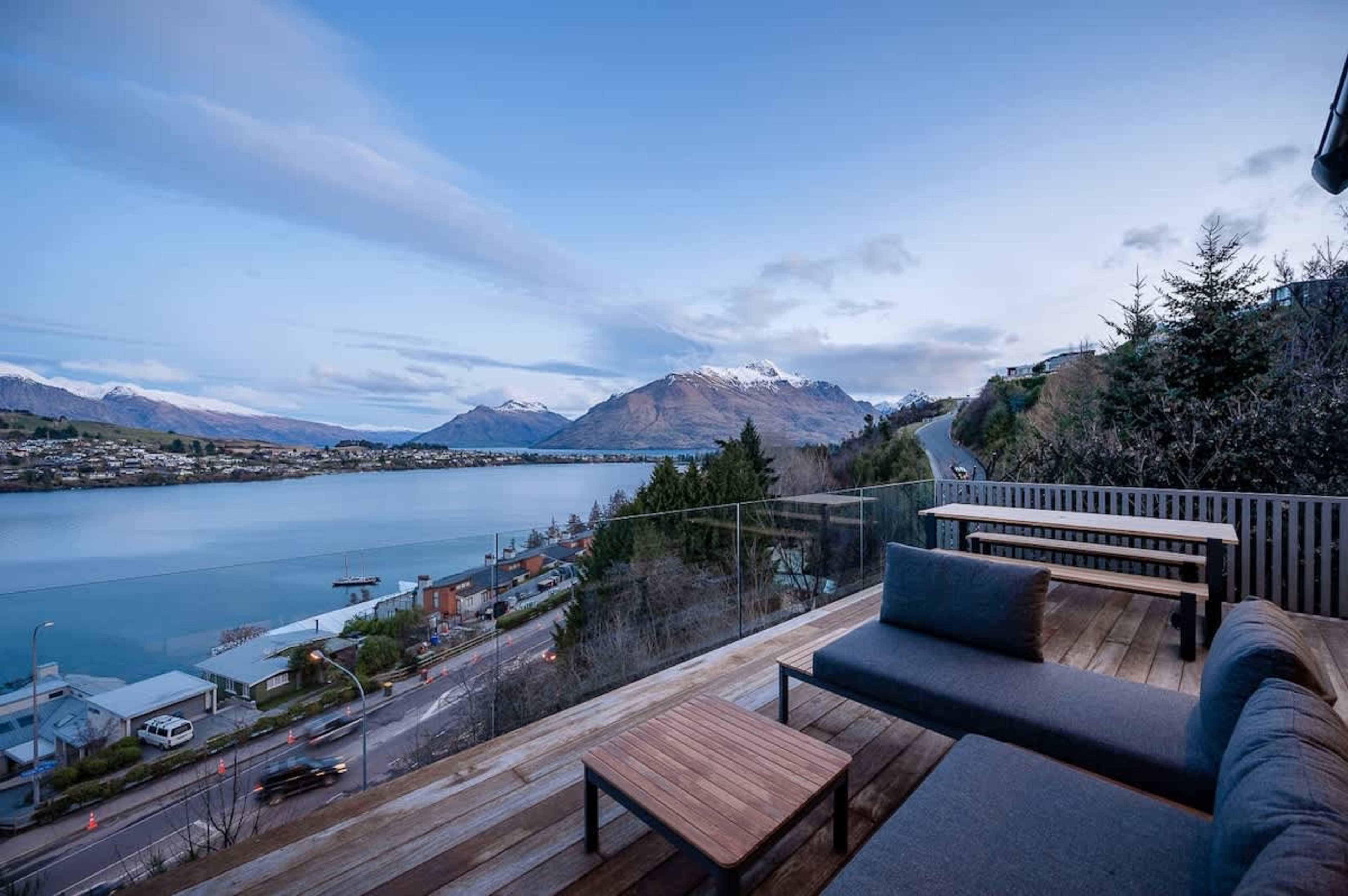 Step out onto the balcony, where you can savor a glass of wine, cook on the BBQ, and enjoy sweeping views of the lake and surrounding mountains, creating an ideal spot for relaxation.
