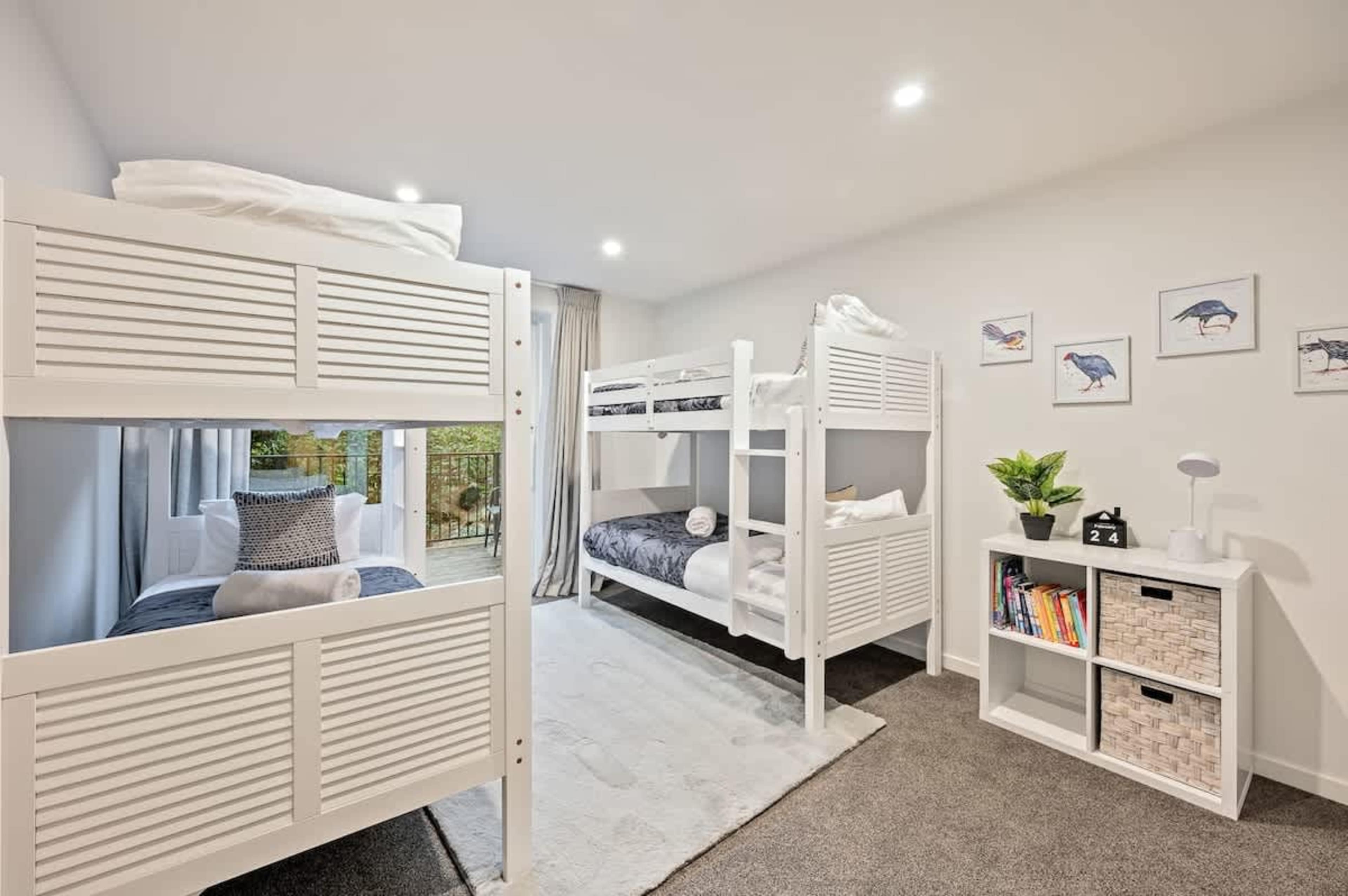 The fourth bedroom is ideal for families, featuring four bunk beds that sleep up to four kids, creating a fun and comfortable space for younger guests.