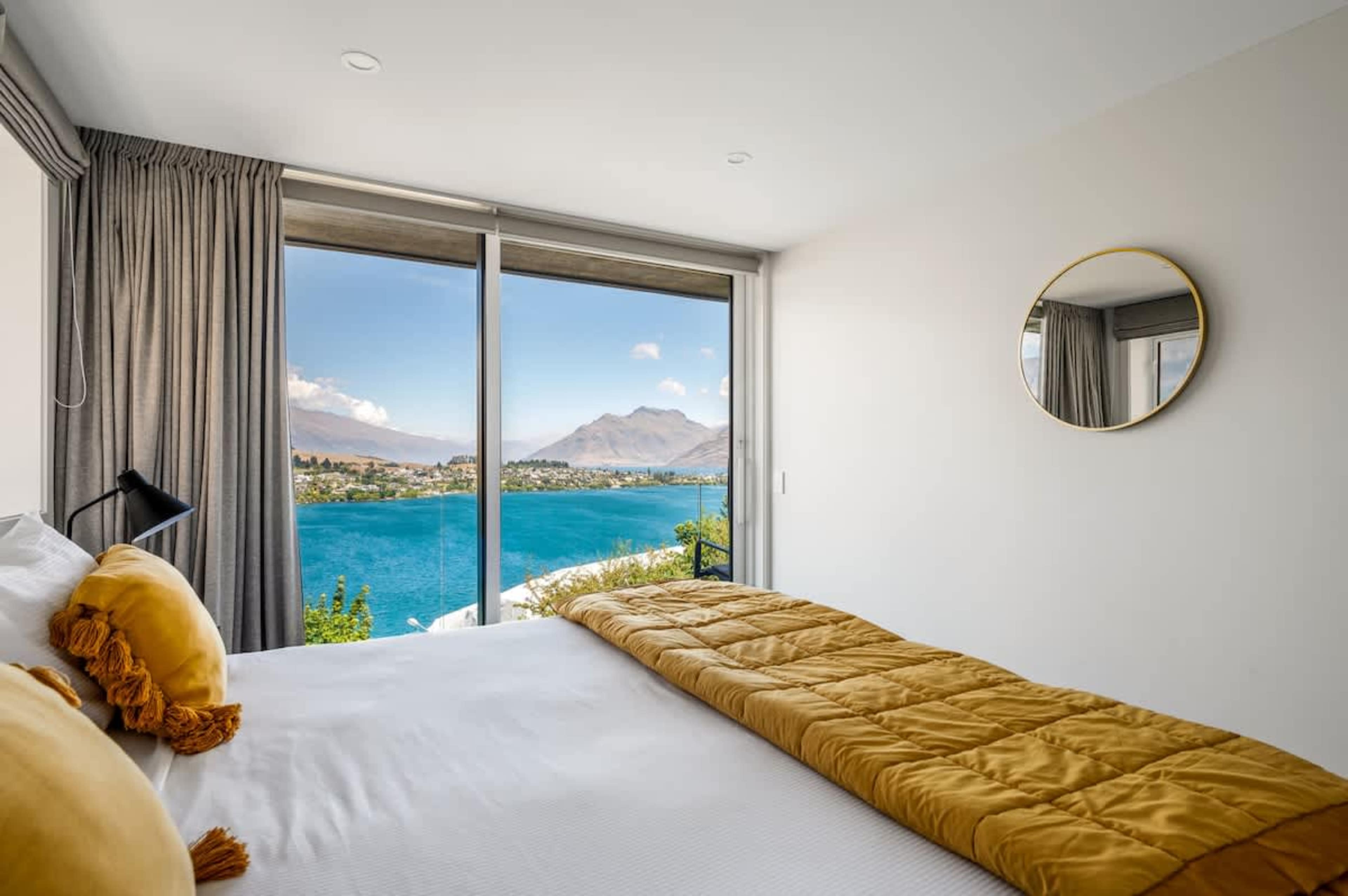 The second bedroom features a comfortable king-split bed stylish decor, and serene views of the surrounding nature, offering a peaceful retreat for restful nights.
