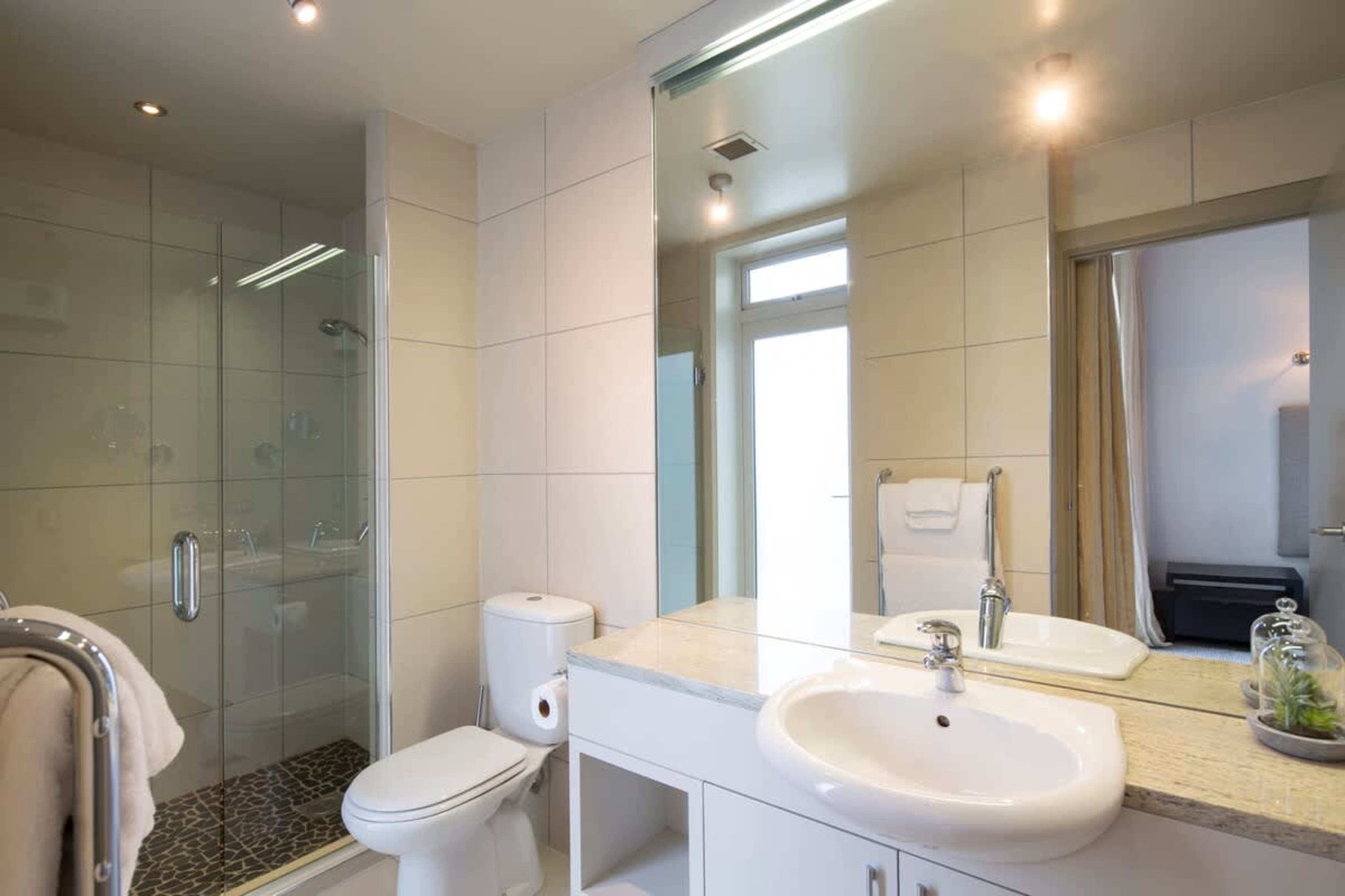 Stylish Second Ensuite: This modern ensuite features a spacious shower, heated towel rails, and premium finishes, offering comfort and convenience for all guests.
