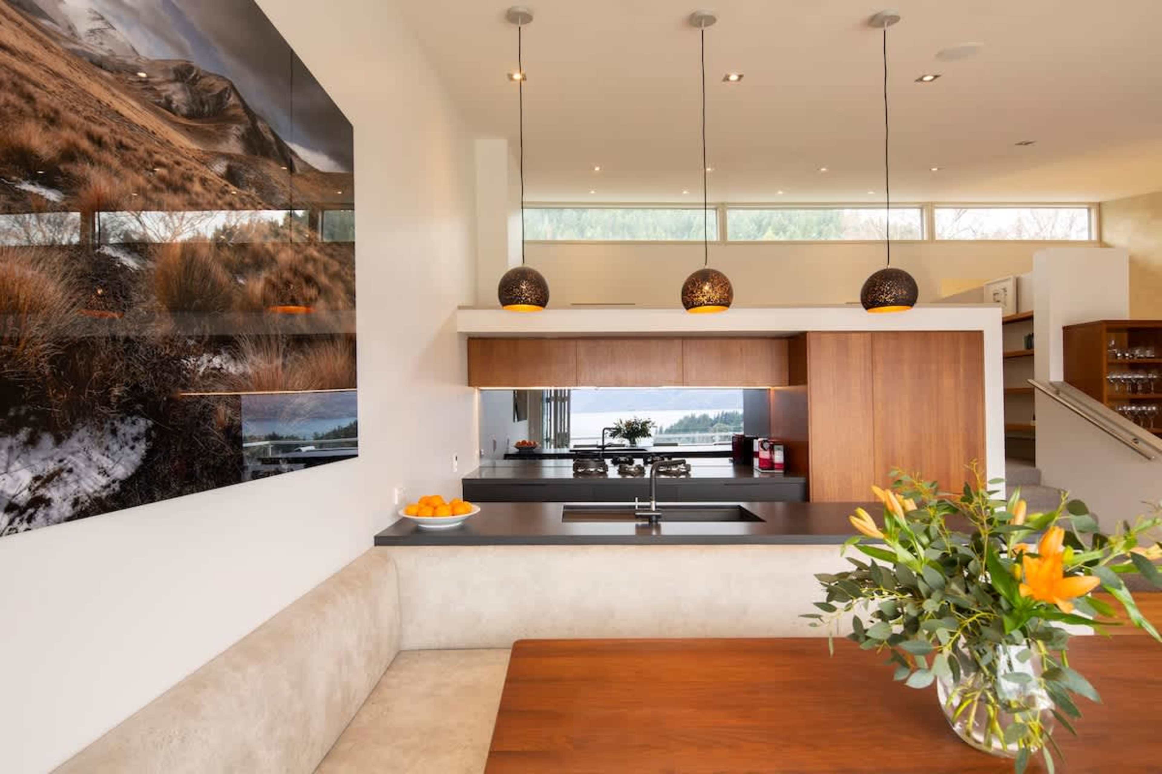 Bright and Scenic: This stylish kitchen combines functionality with beauty, offering panoramic views while you cook or entertain.