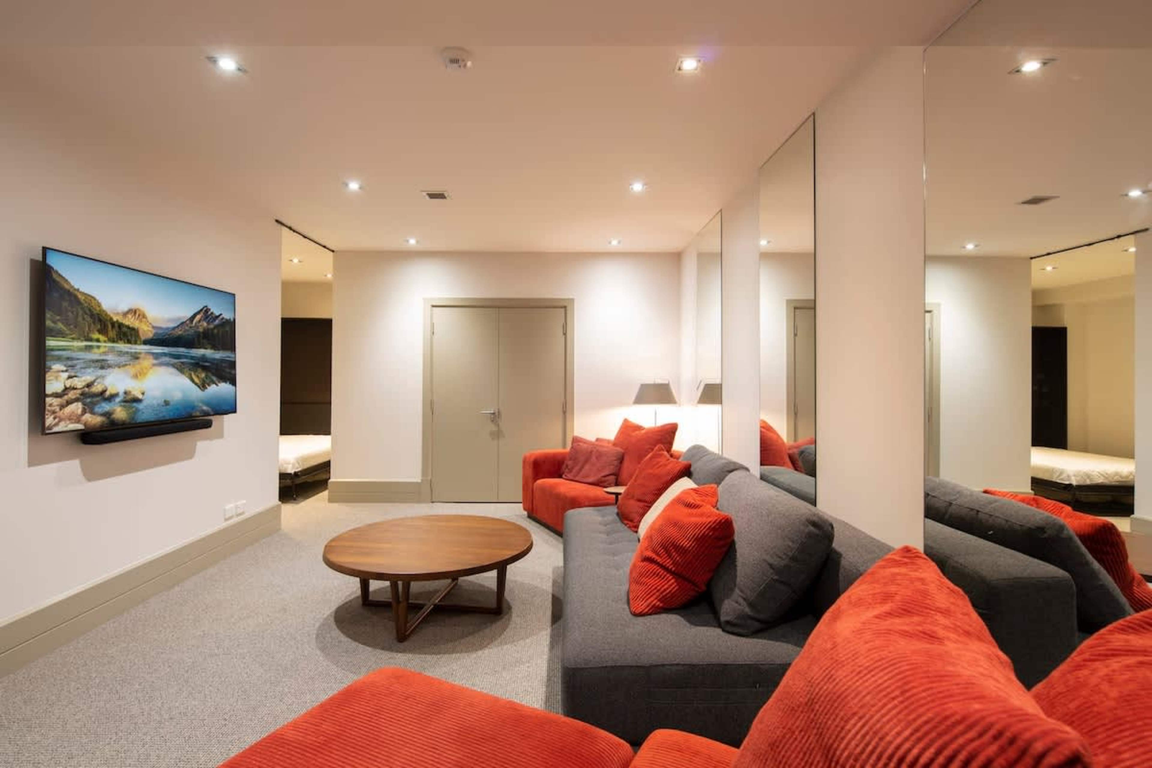 Family-Friendly Retreat: Relax in the media room with ample seating, a warm ambiance, and plenty of entertainment for kids and adults alike.

Luxury accomodation Queenstown