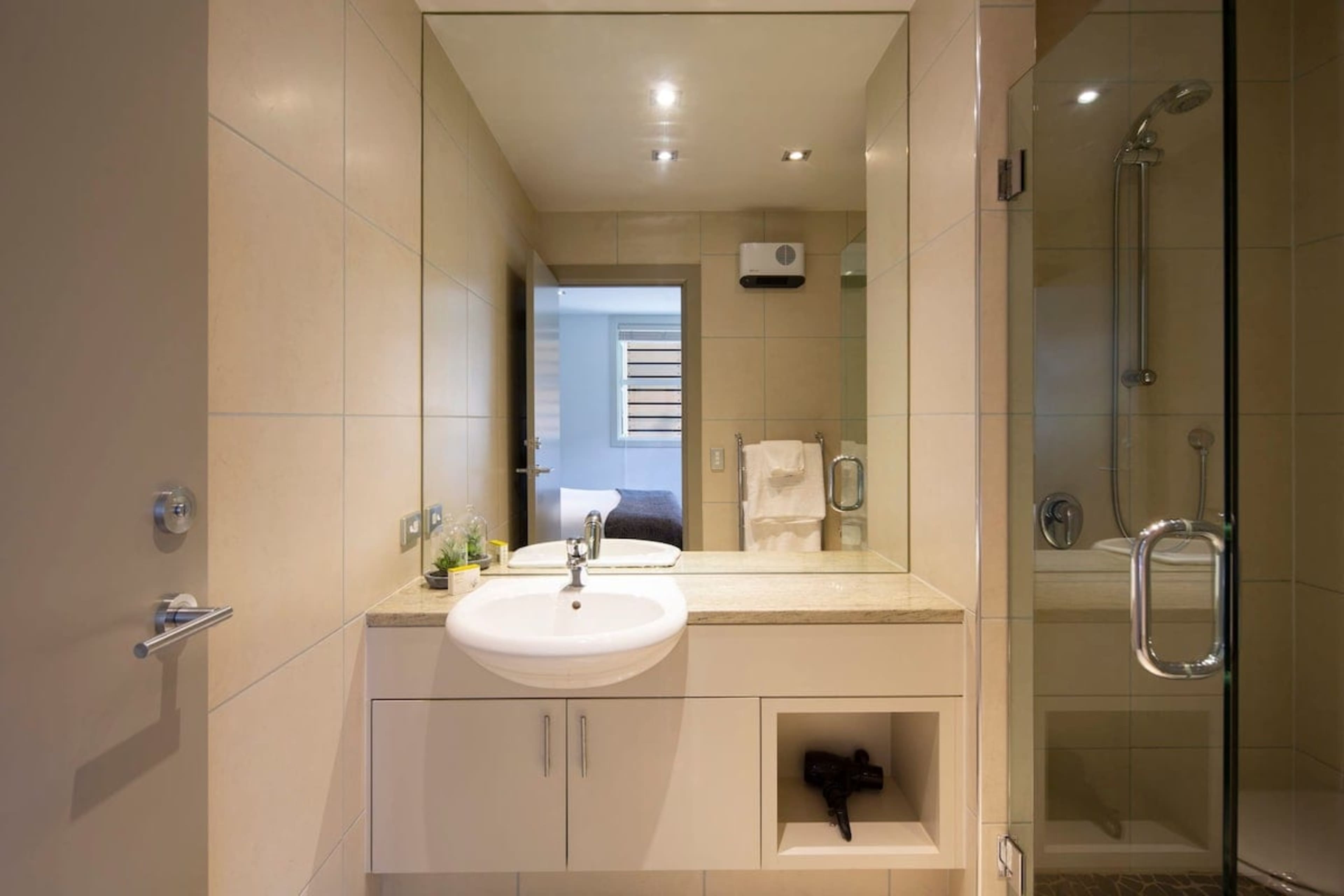 
Convenient Third Bathroom: A sleek and functional bathroom with a spacious shower, heated towel rails, and modern fixtures, ensuring comfort and ease for your stay.