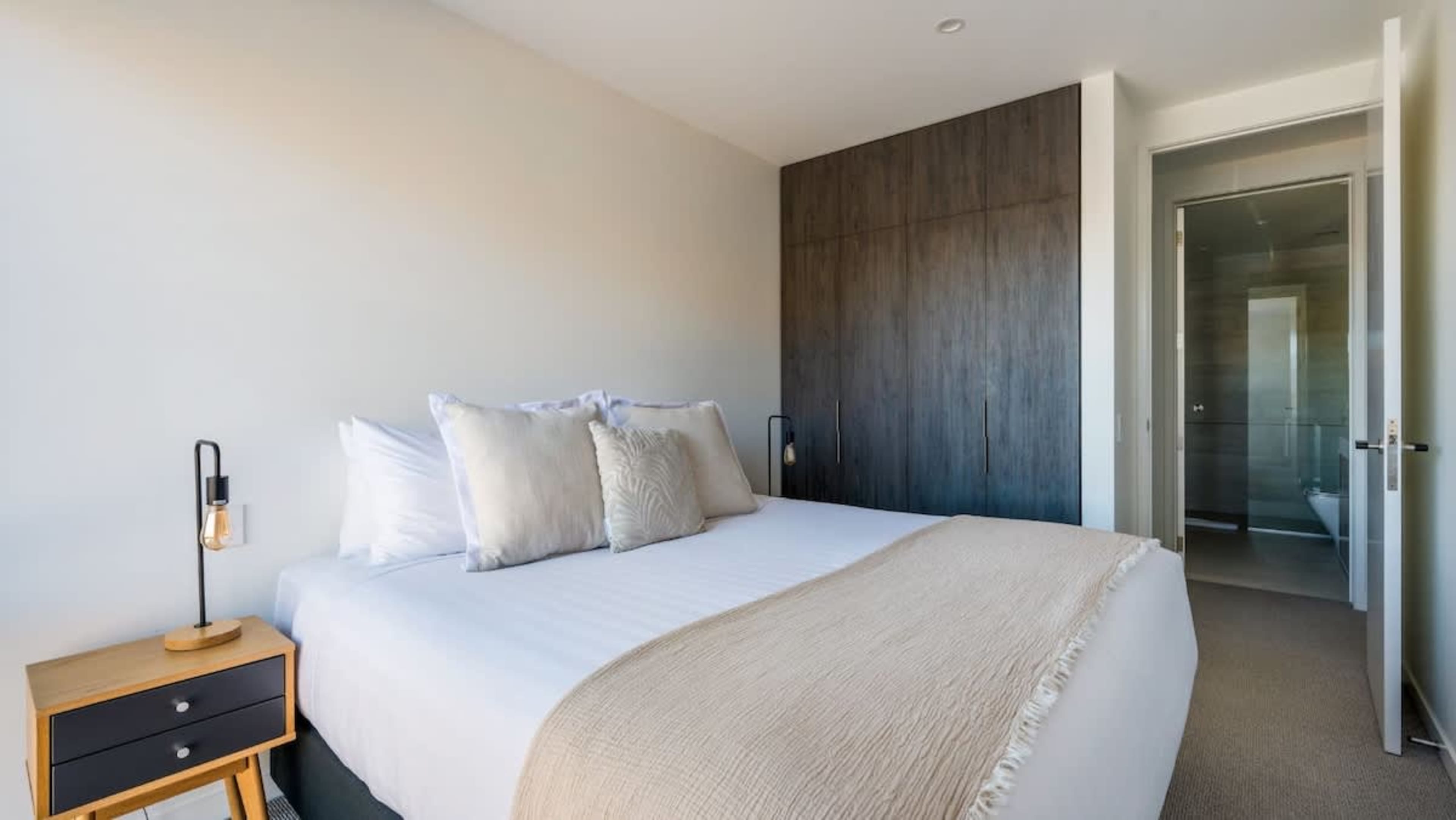 This cozy third bedroom comes with a king-sized split bed, allowing for customizable comfort, and is designed with stylish furnishings to create a serene retreat.