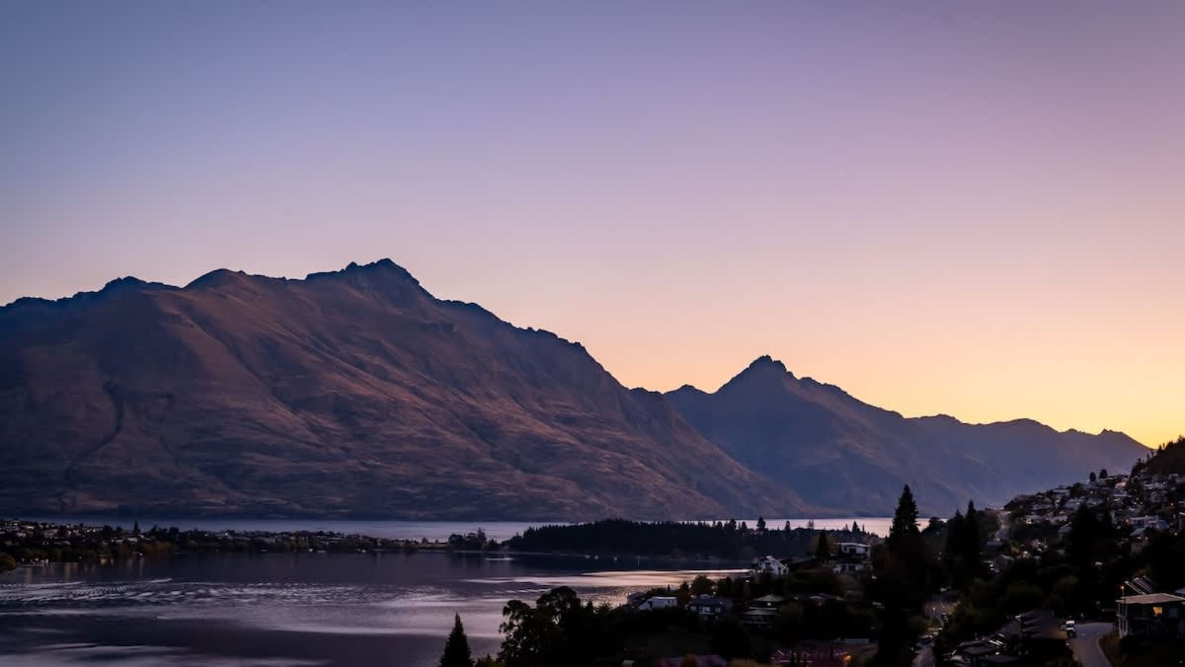 Relax on the patio with unobstructed views of Lake Wakatipu and the Remarkables, a perfect spot to enjoy the outdoors, whether for a meal or quiet moments of reflection.