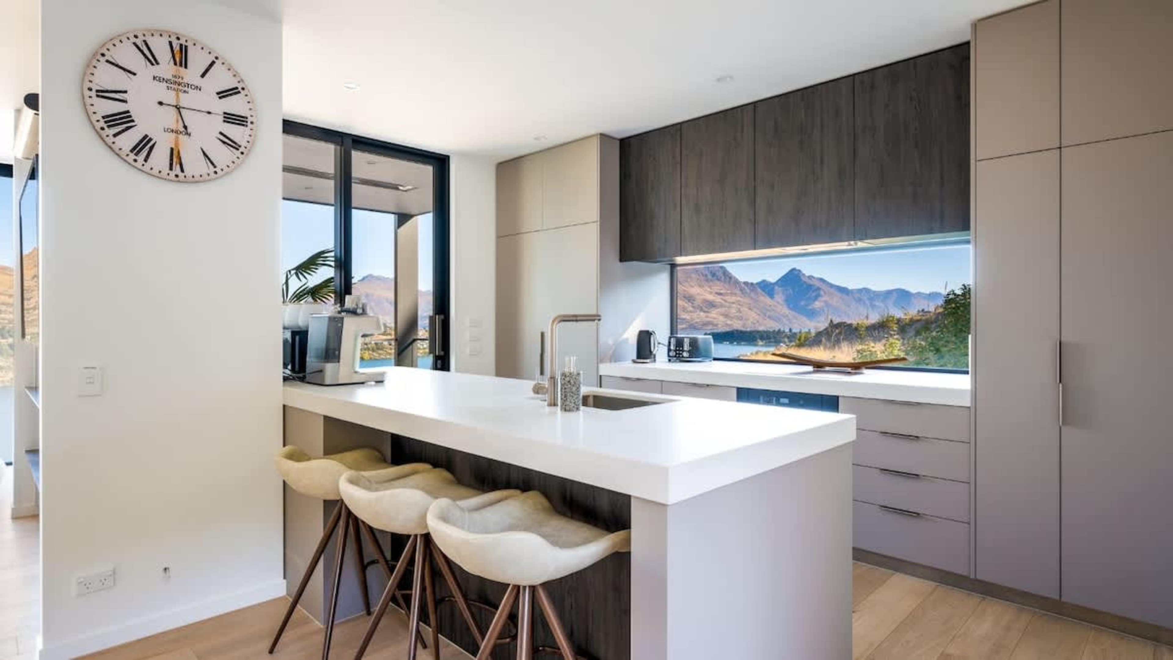 Featuring premium stainless steel appliances, a large fridge, and a Coffee machine, this kitchen combines style and functionality for your cooking and coffee needs.