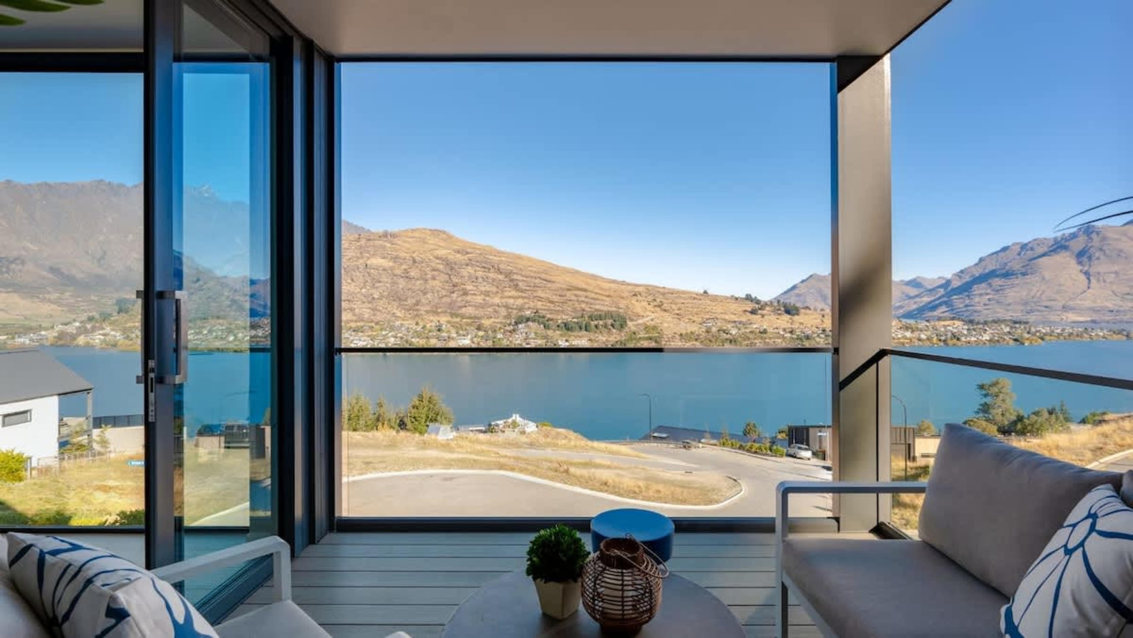 The patio boasts incredible views of the lake and mountains, with ample space for outdoor dining or simply enjoying the fresh air and stunning surroundings.