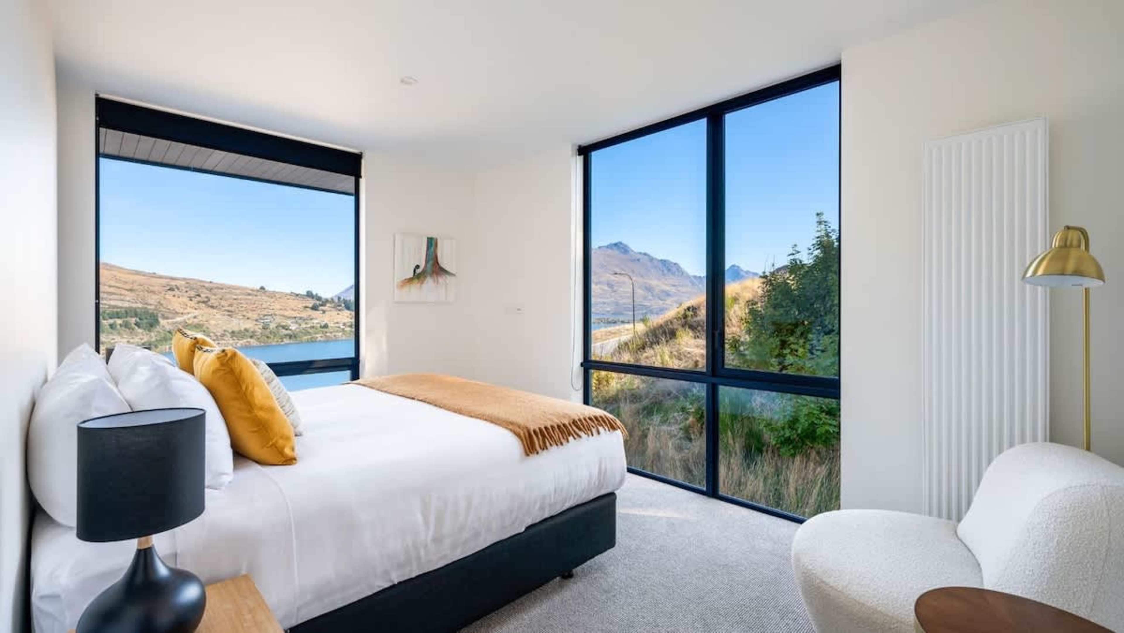 Relax in the elegant master bedroom, complete with a king bed, a private ensuite bathroom, and a large wardrobe—your perfect retreat with scenic views.