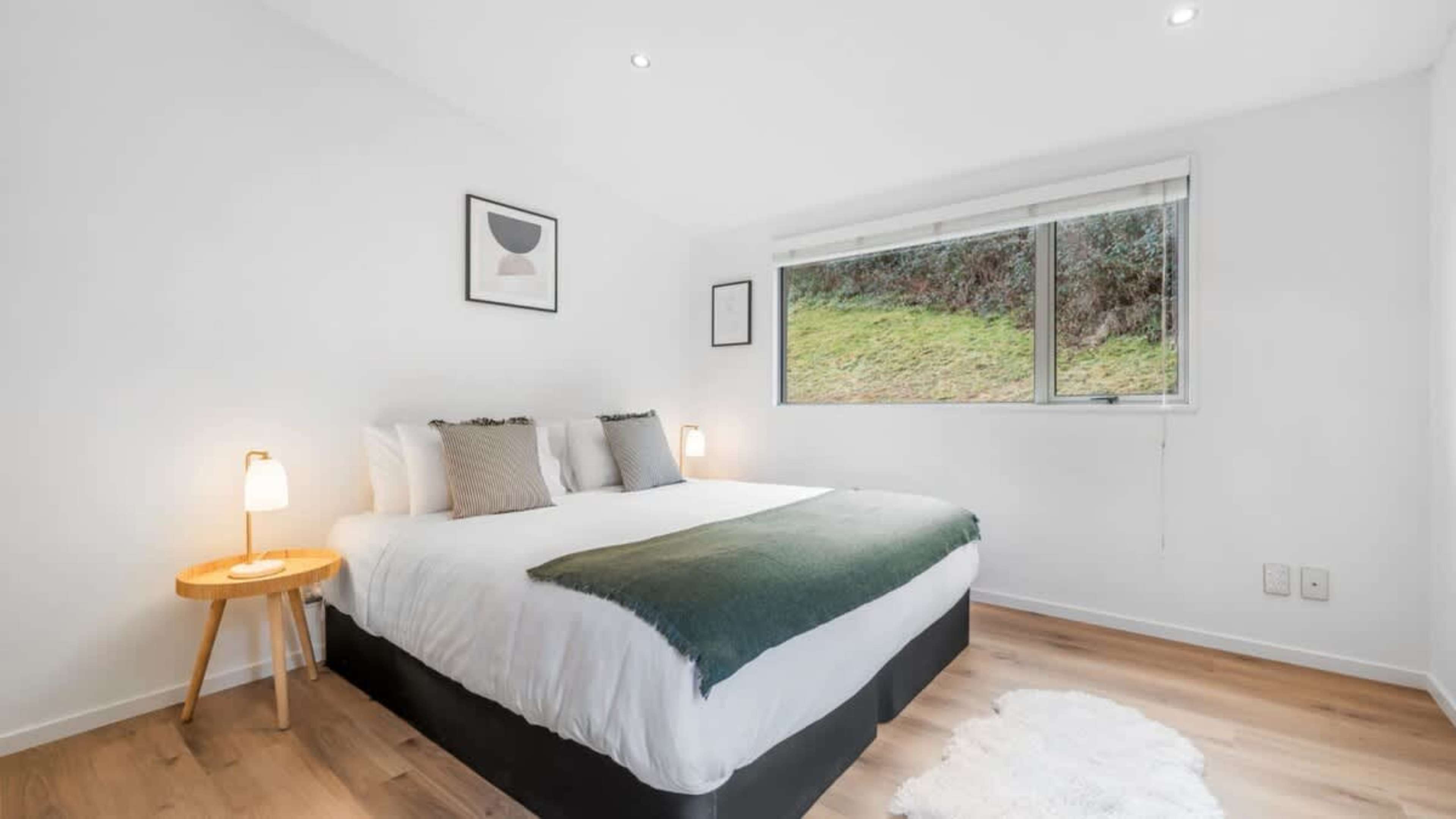 Spacious and Comfortable Fourth Bedroom
The fourth bedroom offers a serene and spacious setting, with cozy furnishings and a restful environment, ensuring a perfect night’s sleep in Queenstown.