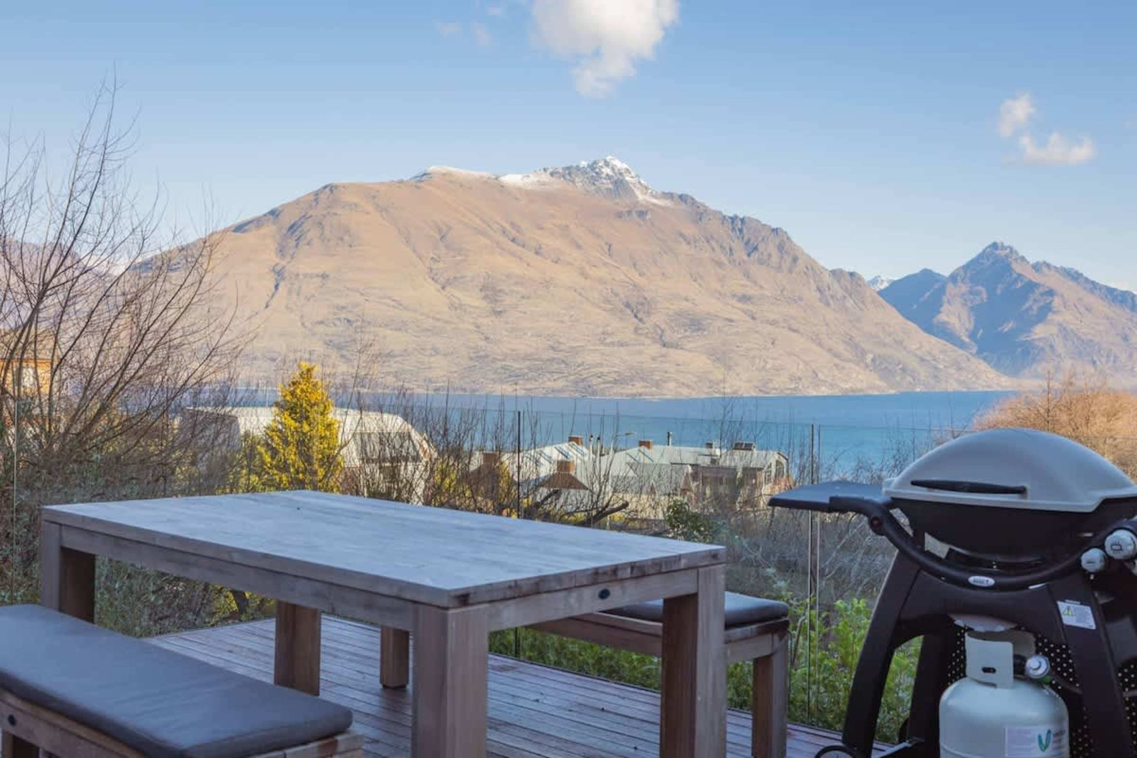 Spacious Deck with Outdoor Dining
Step out onto the expansive deck, complete with outdoor dining and a BBQ, perfect for enjoying meals while soaking in stunning views of the lake and mountains.