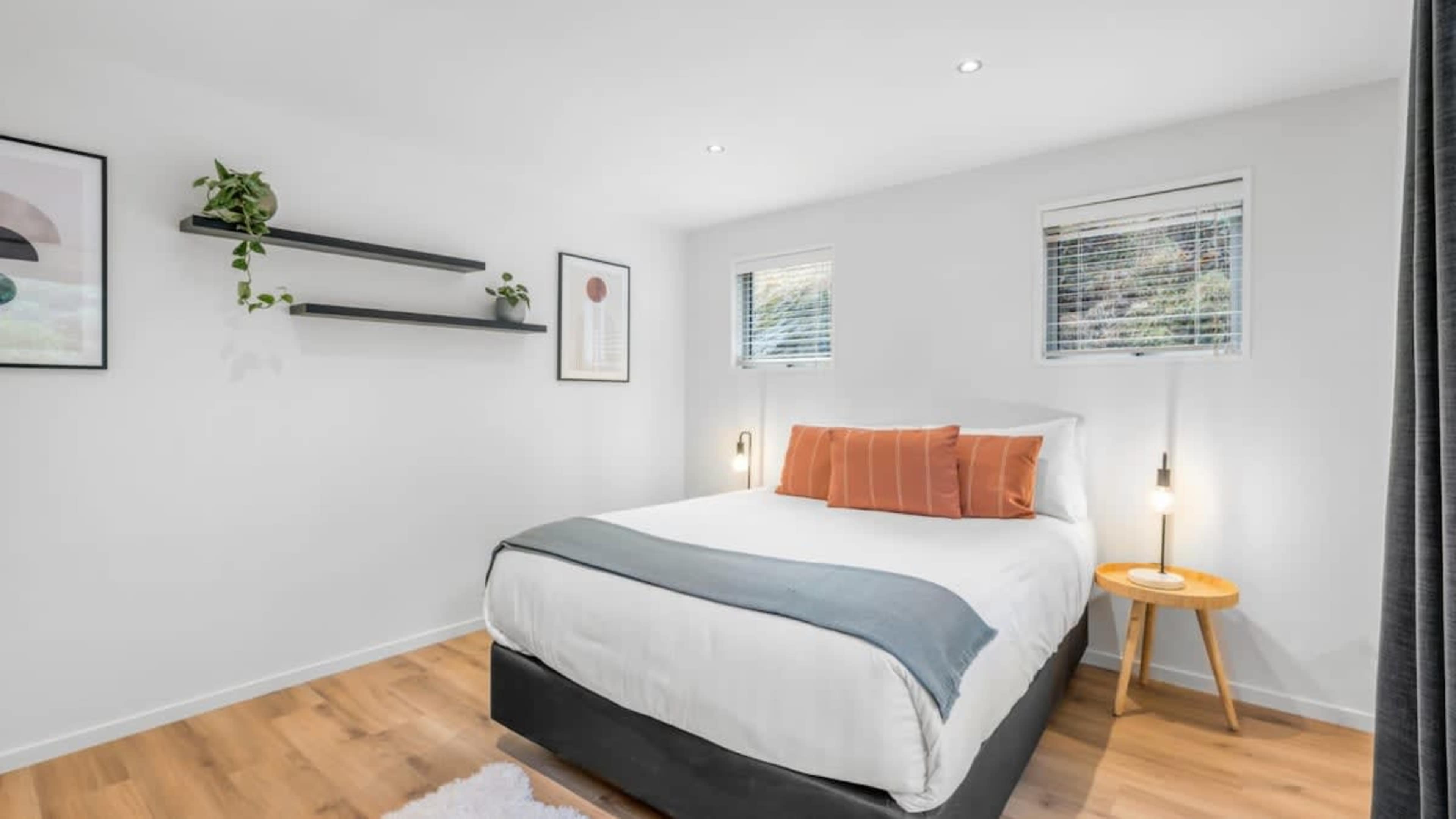 Spacious Bedroom with Ensuite and Outdoor Space
The third bedroom offers a private ensuite and seamless access to the outdoor patio, providing a serene retreat with both comfort and outdoor relaxation.