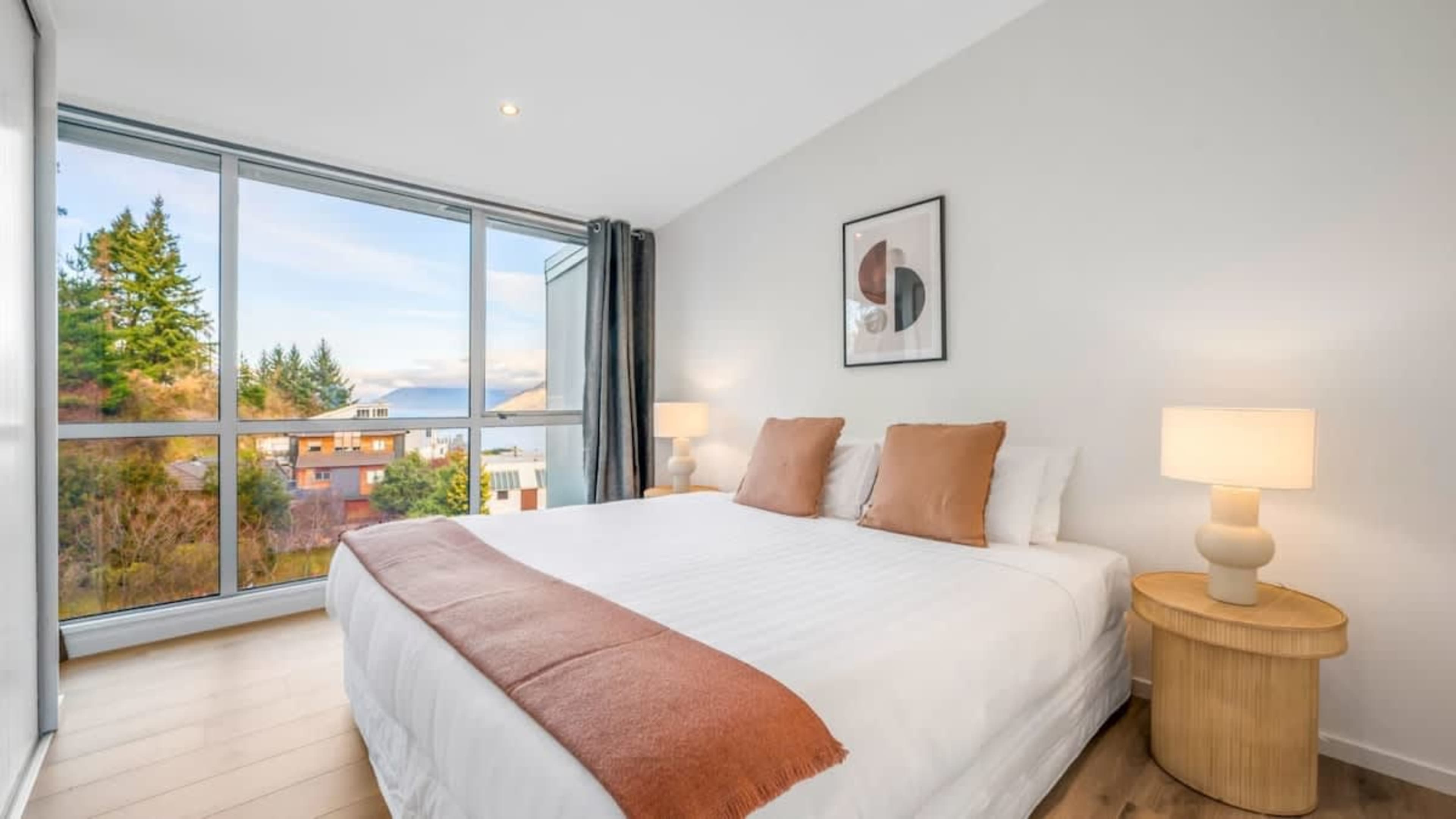 Master Bedroom with Breathtaking Views
Relax in the spacious master bedroom, offering panoramic views of the lake and mountains, creating a serene retreat to unwind after a day of exploring Queenstown.